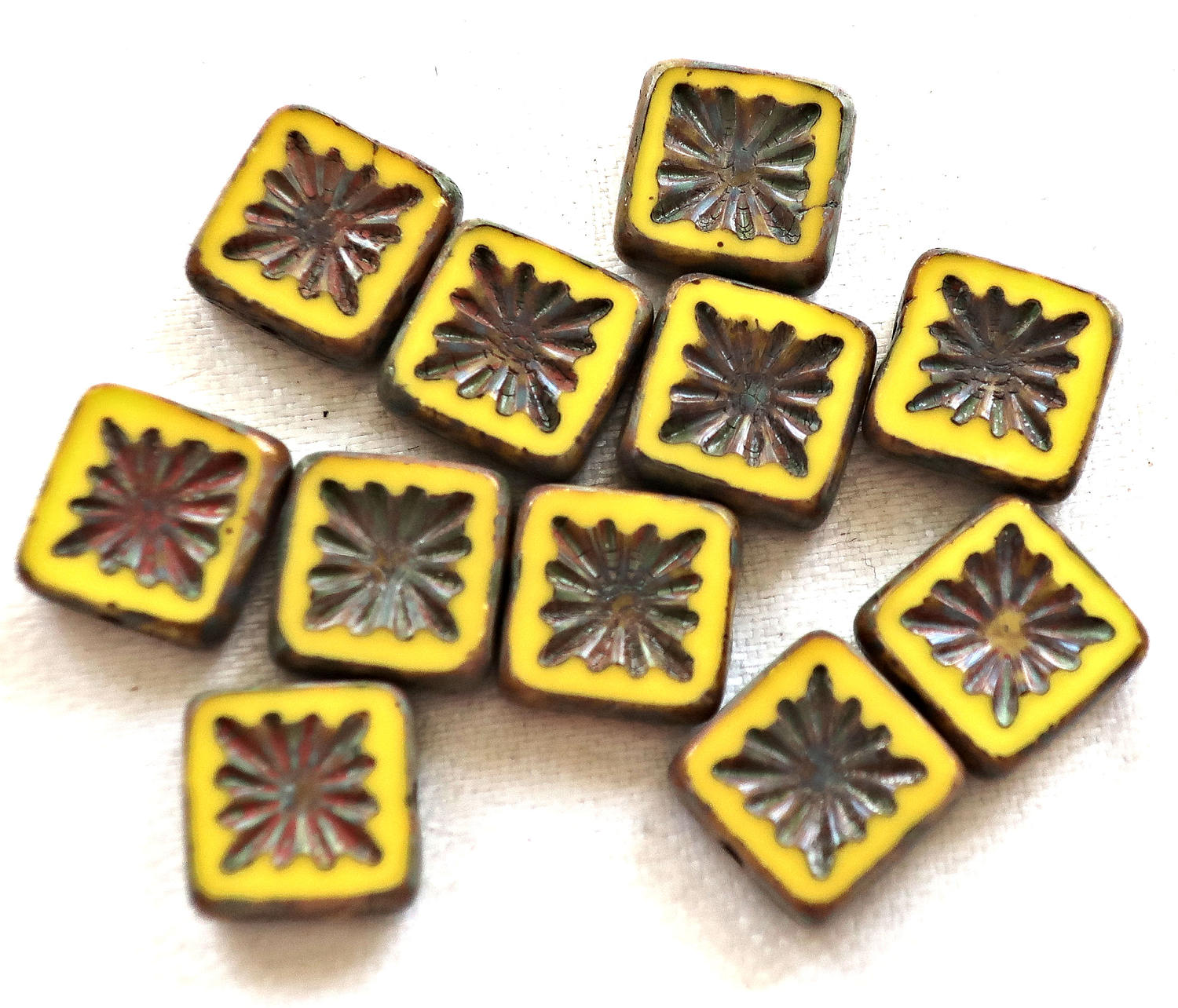 Ten 10mm x 10mm square opaque yellow carved, table cut, picasso Czech glass beads, front and back carved C6701