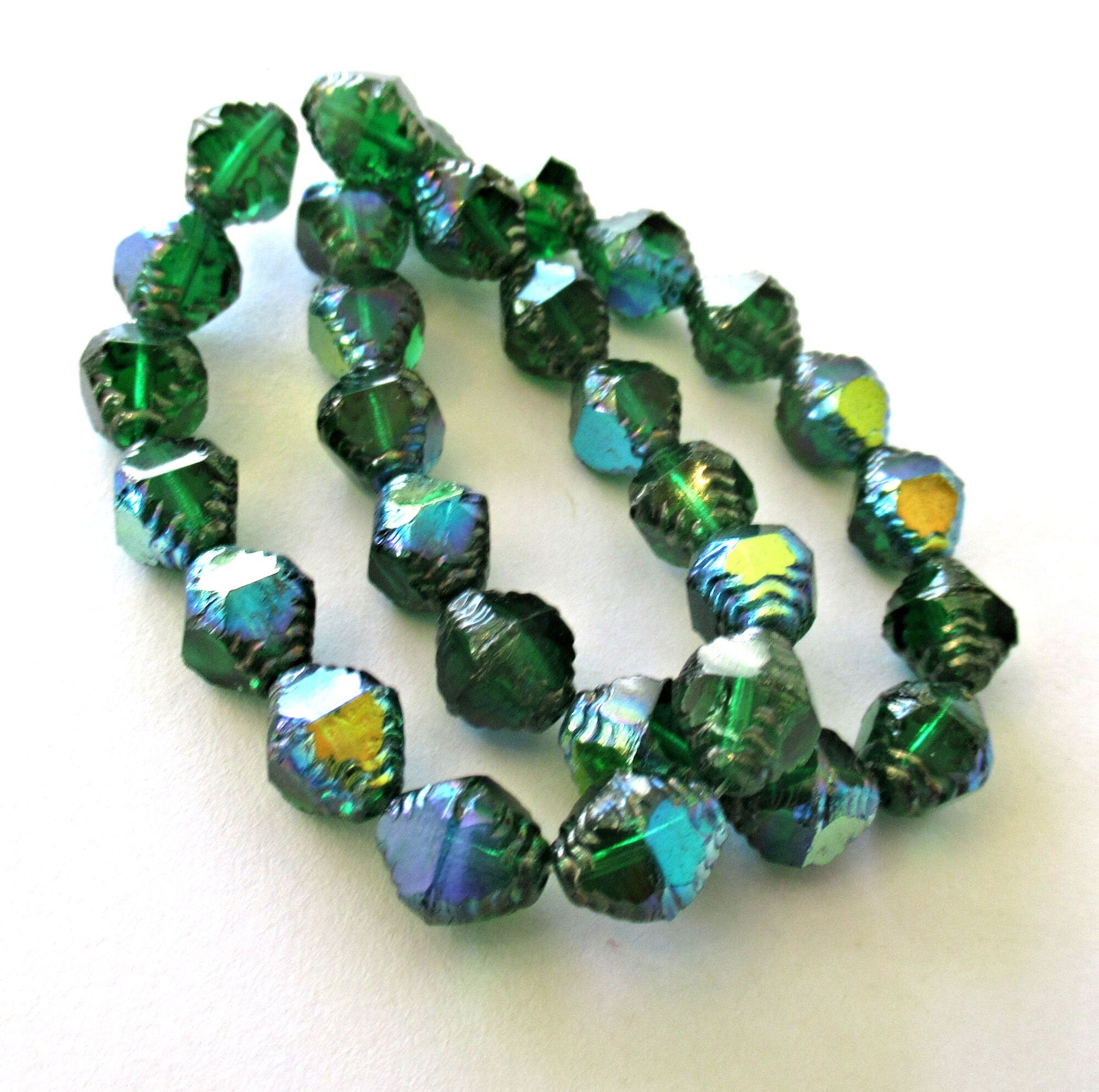 Fifteen Czech glass bicones - 10 x 8mm emerald green ab w/ silver accents - table cut carved notched bicone beads - C00362