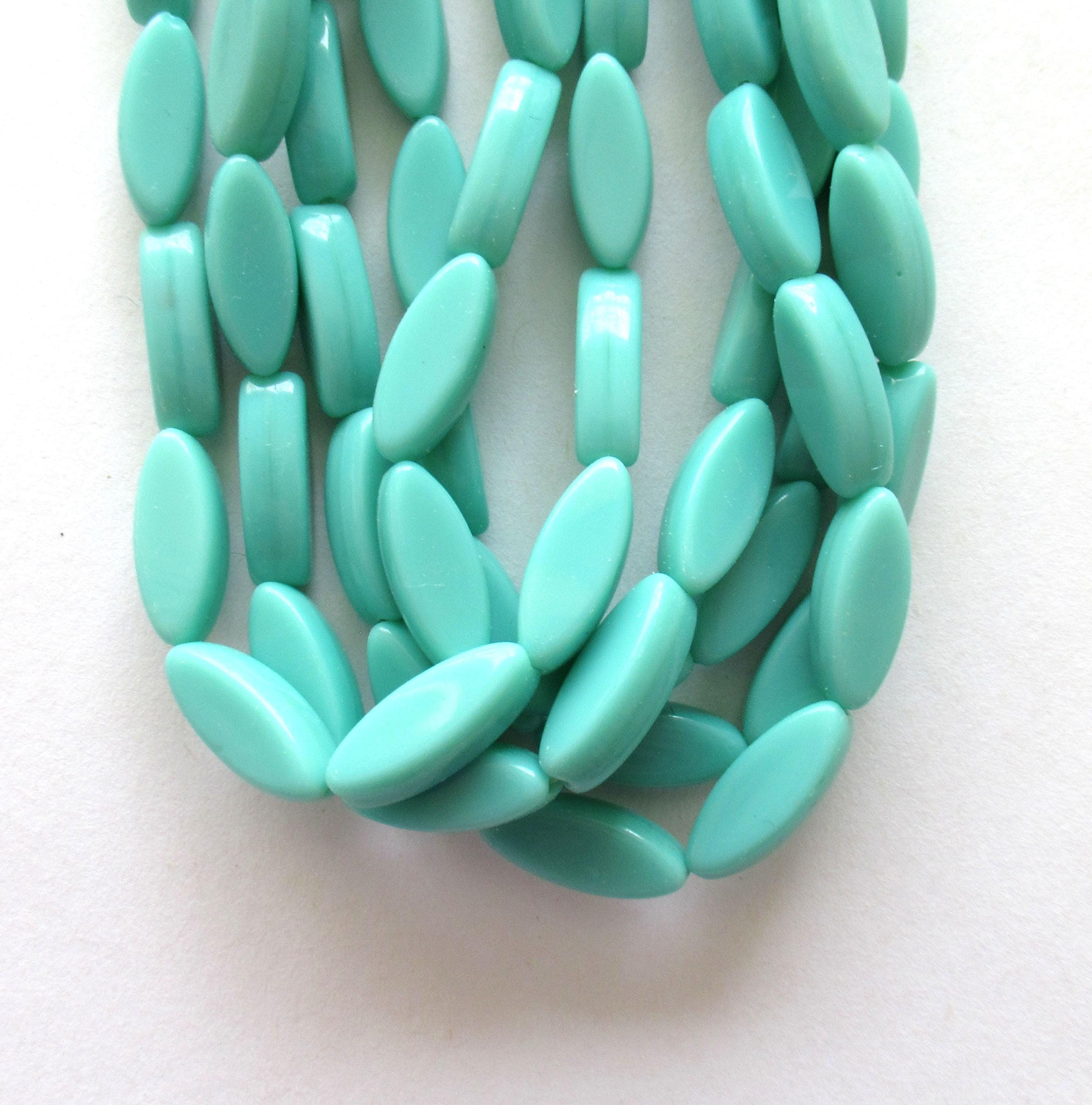 Ten Czech glass green spindle beads - 16 x 6mm - opaque light turquoise green - oblong oval pressed glass beads - C0007