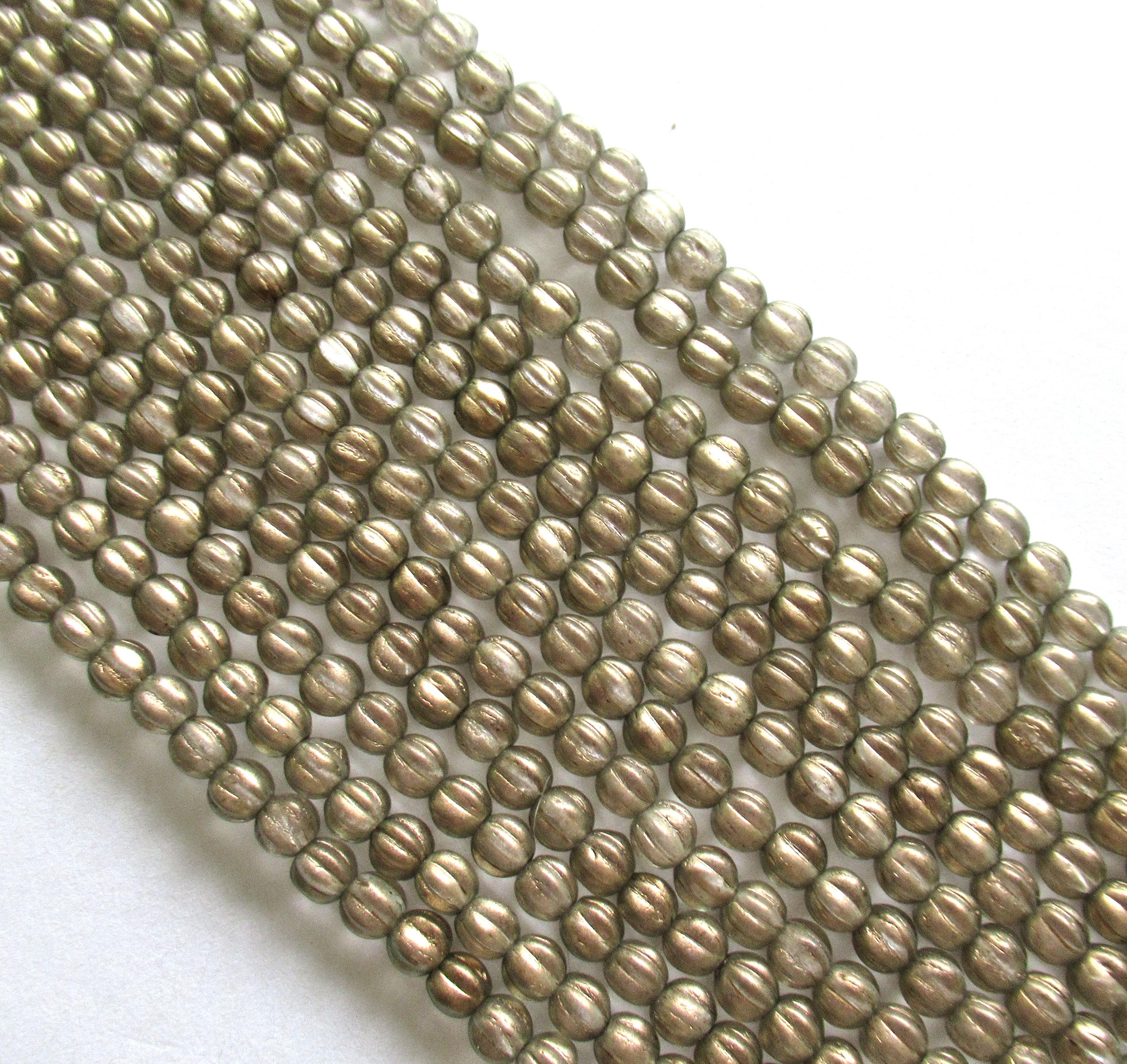 Fifty 5mm Czech glass melon beads - Halo Linen beads - neutral clear beads with a gold finish - C00201