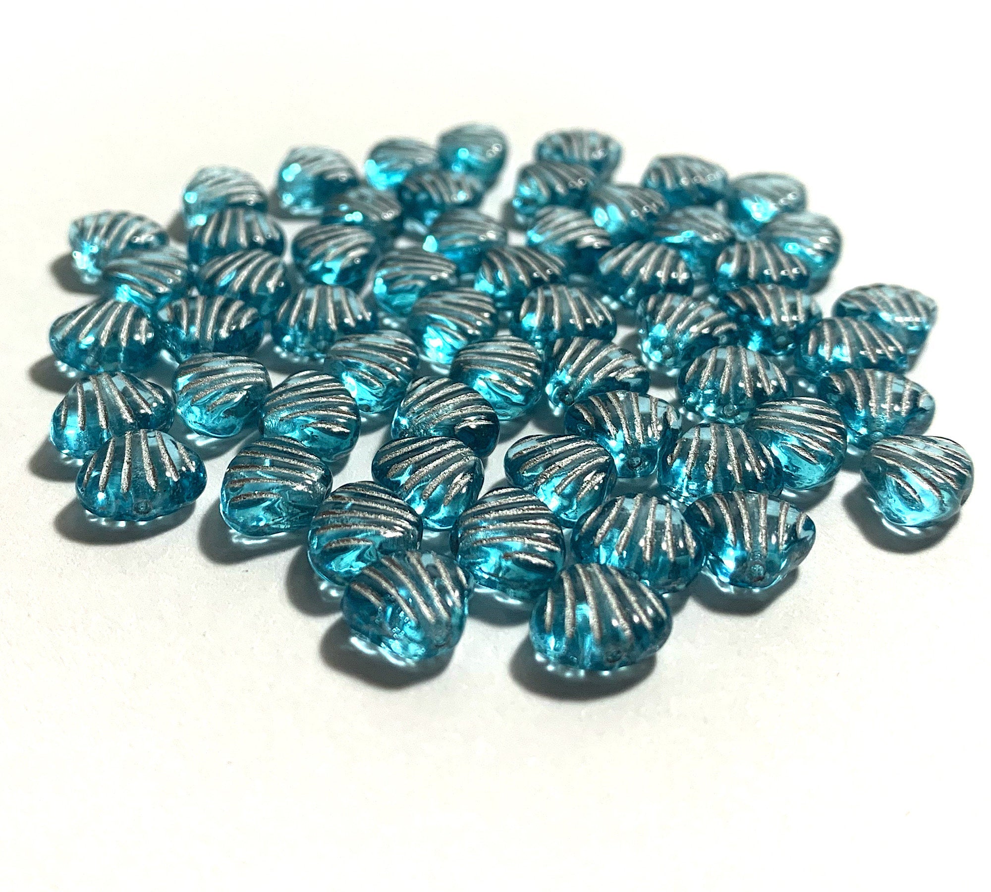 Twenty 8mm seashell, fan or clam beads - transparent aqua blue with silver accents - C0098