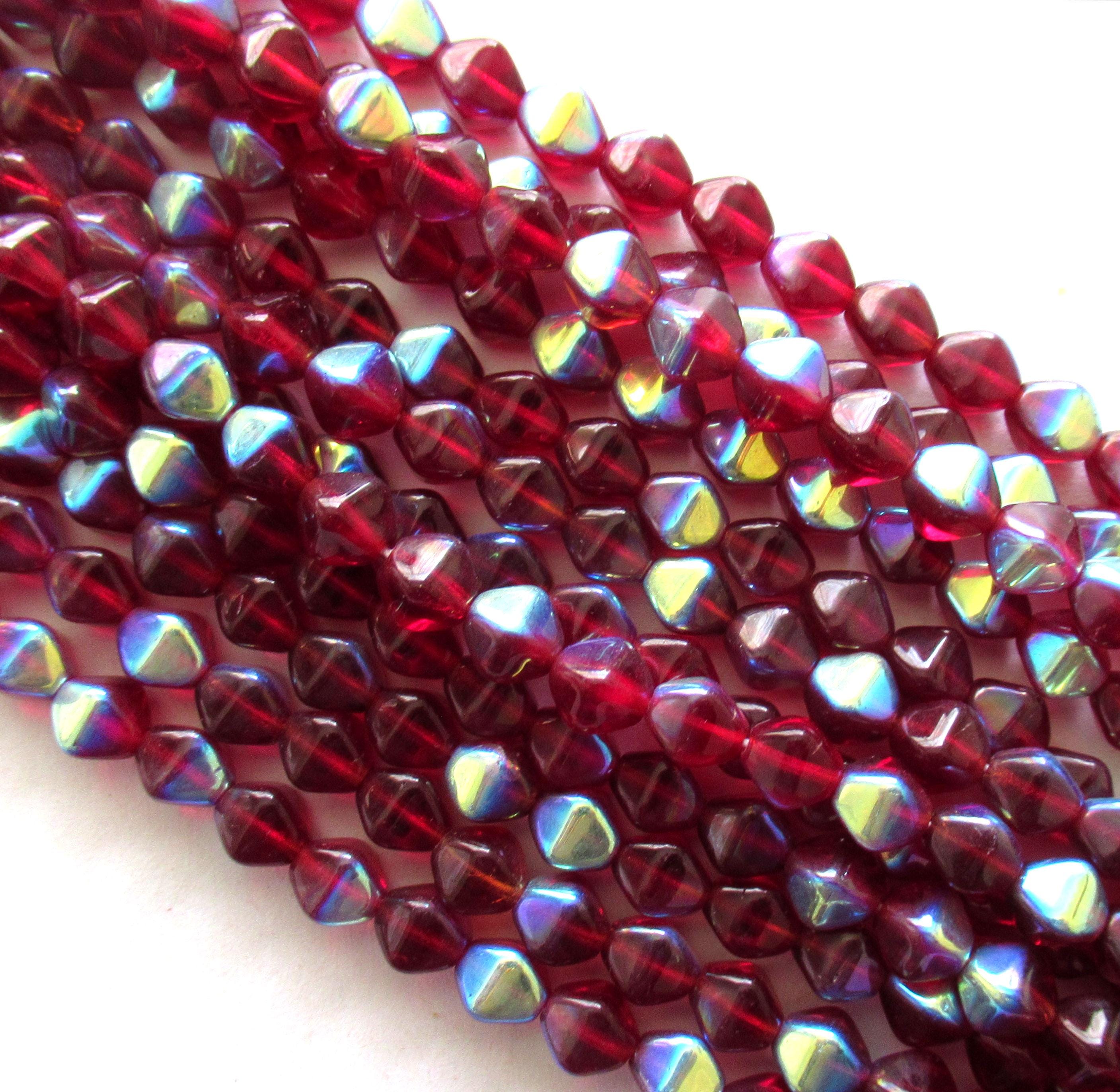 Fifty 6mm Czech glass bicones - ruby red / light garnet ab beads - pressed glass bicone beads - C0055