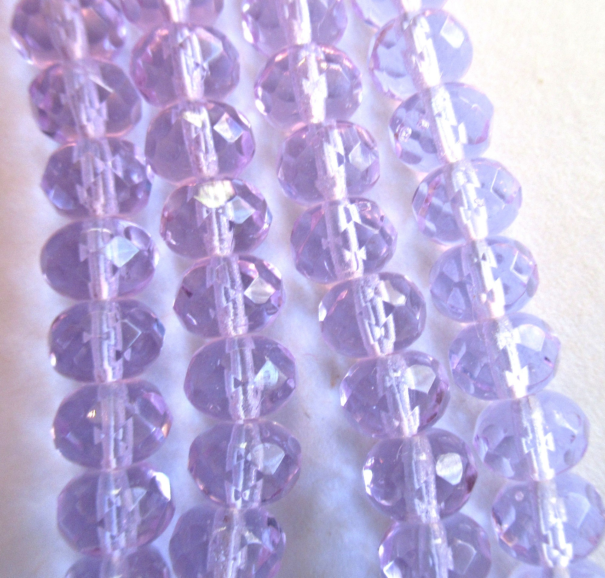 Lot of 25 faceted puffy rondelle or donut beads - 5 x 7mm transparent alexandrite or lavender beads - C0055