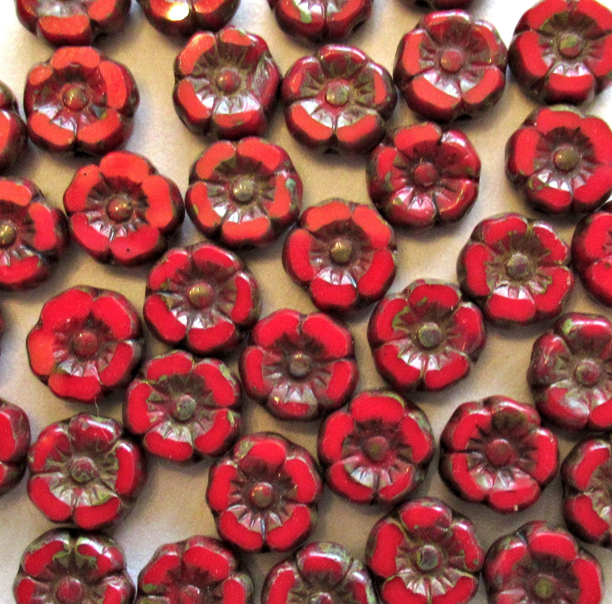 Twelve small 7mm Czech glass flower beads - opaque red w/ picasso accents - table cut carved Hawaiian hibiscus flower beads C00911