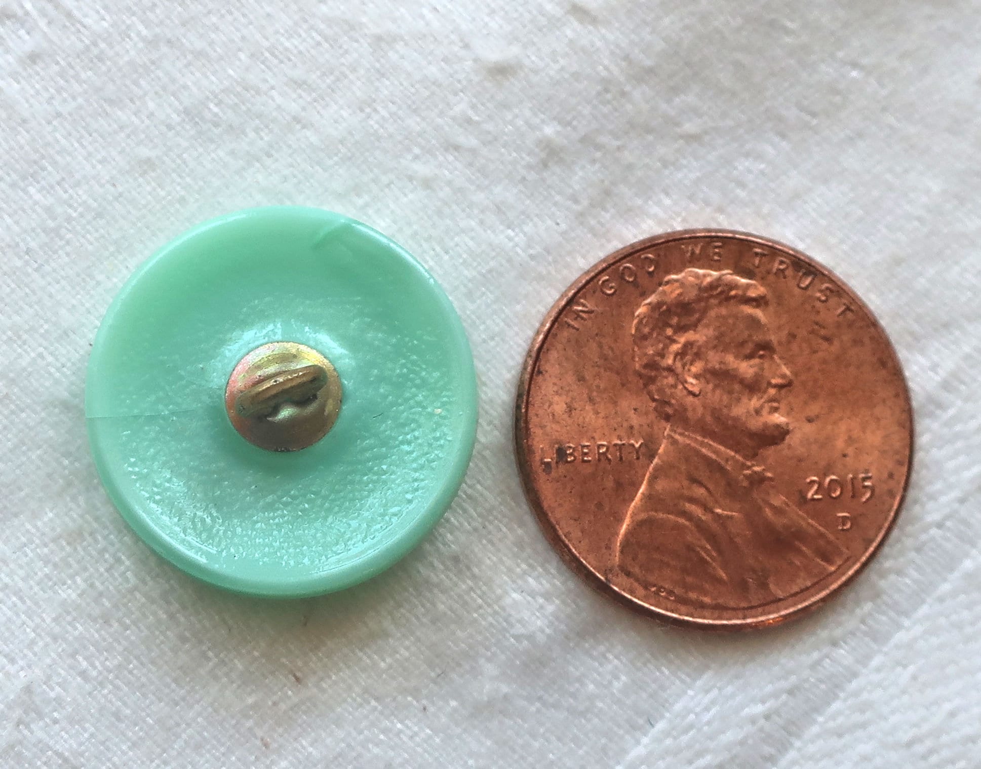 One 18mm Czech glass button, opaque mint green with a gold dragonfly decorative shank button 52201