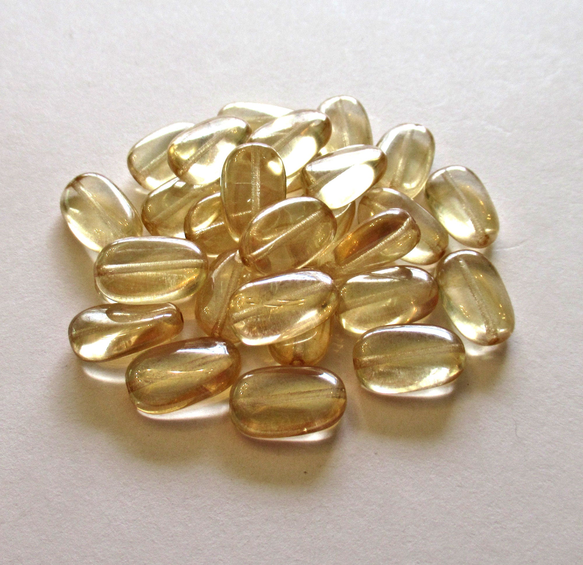 Lot of 15 slightly twisted oval Czech glass beads - 14mm x 8mm champagne - pressed glass beads C0062