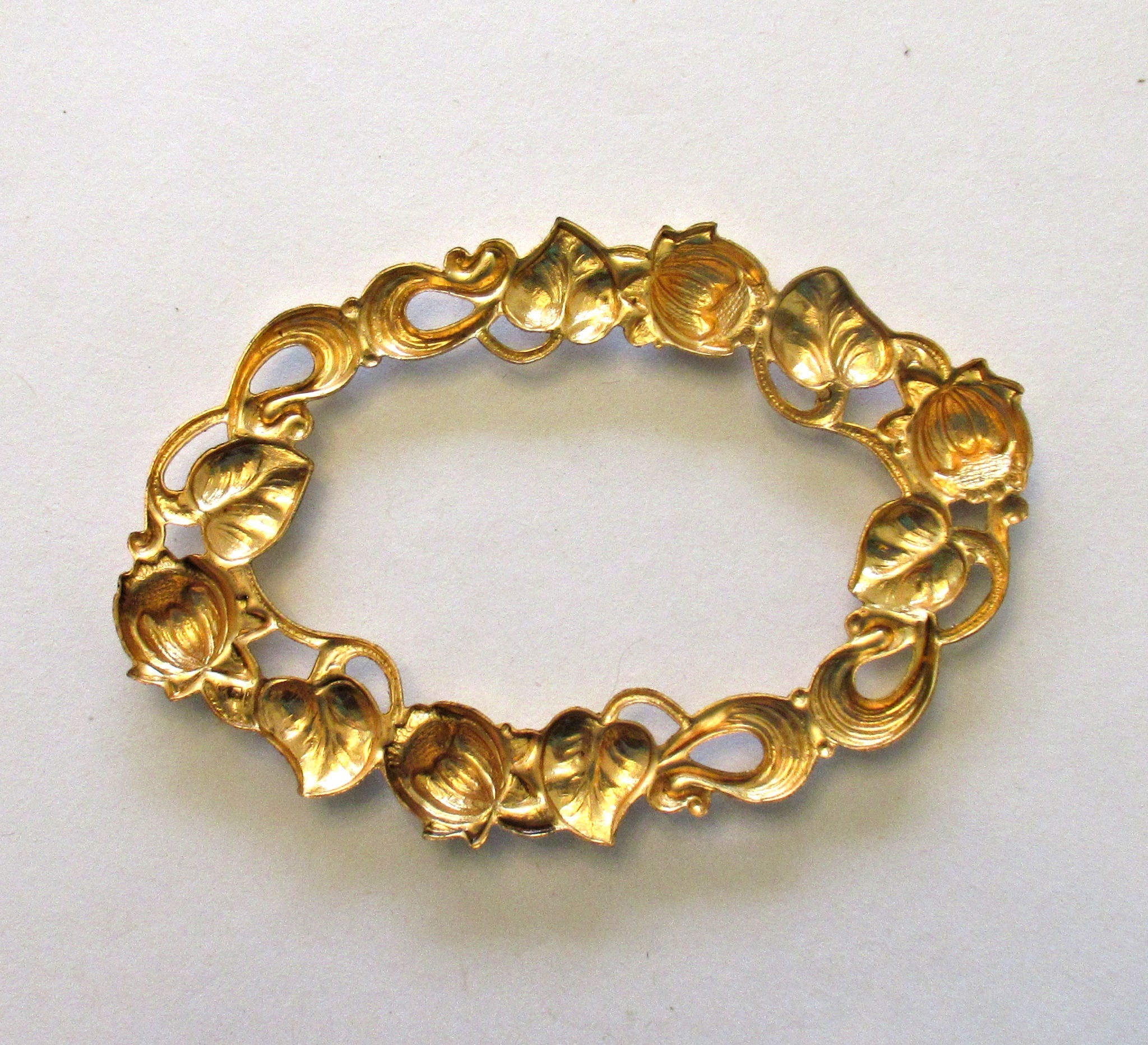 1 large oval brass stamping frame - Ornate Victorian ornament - component - 3.125" x 2.125" made in the USA C00271