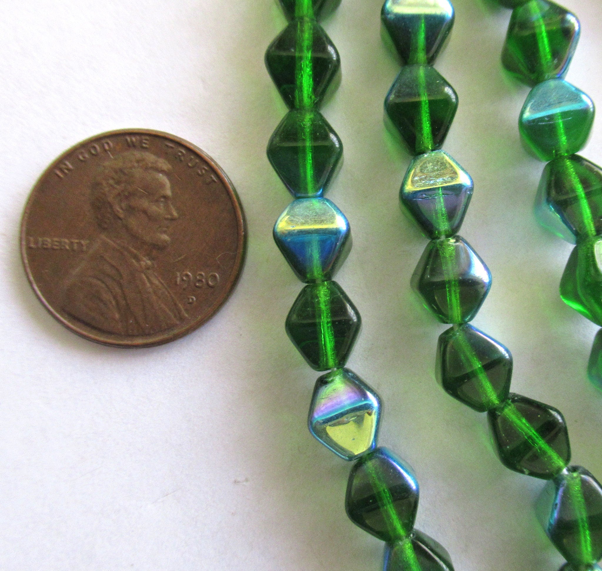 Twenty-five 8mm Czech glass bicone beads - Emerald Green AB pressed glass bicones - C0063