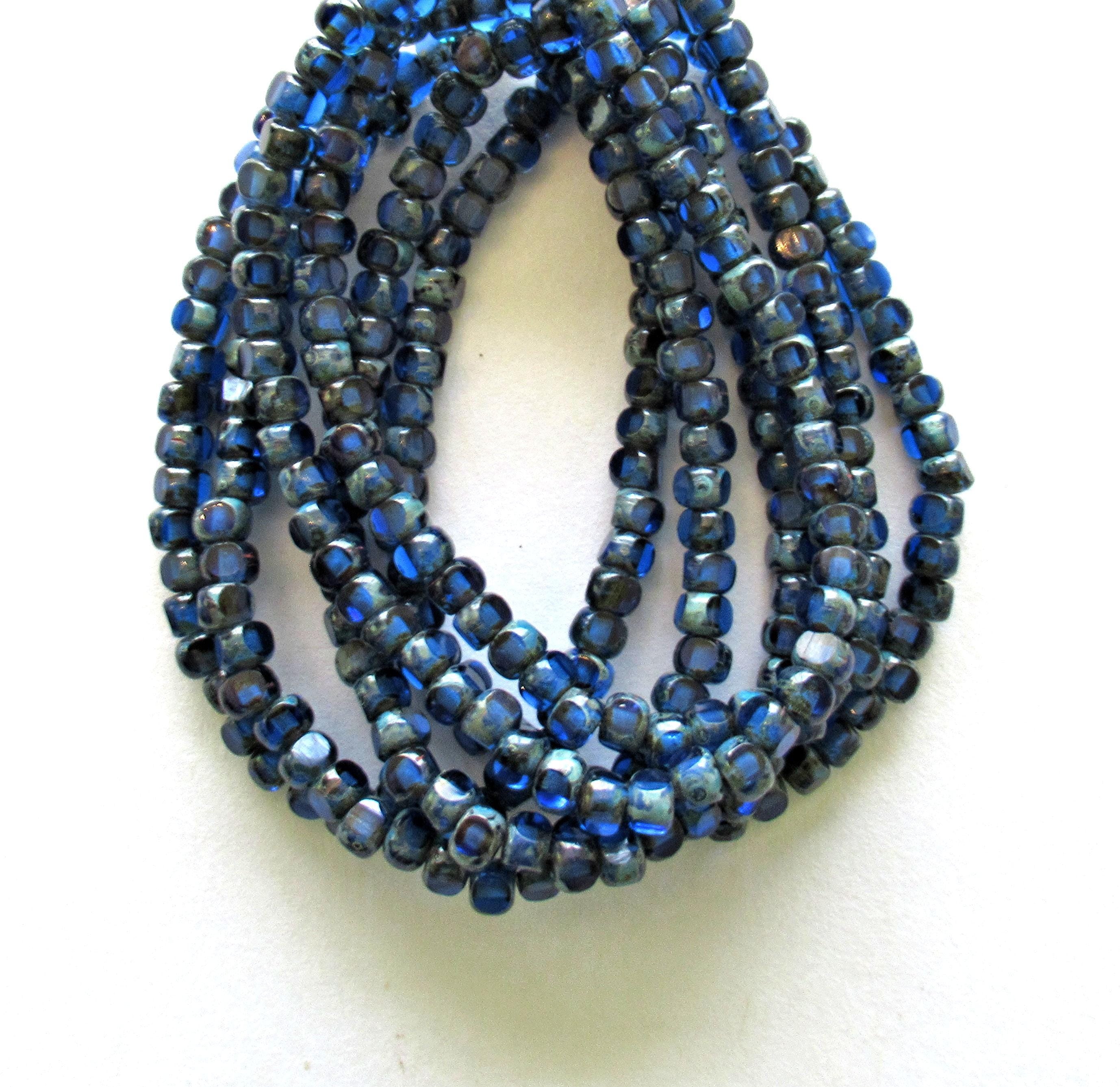 50 Czech glass 6/0 faceted seed beads - transparent sapphire blue with picasso accents - 3 cut - tri-cut - 4 x 3mm beads - C00041