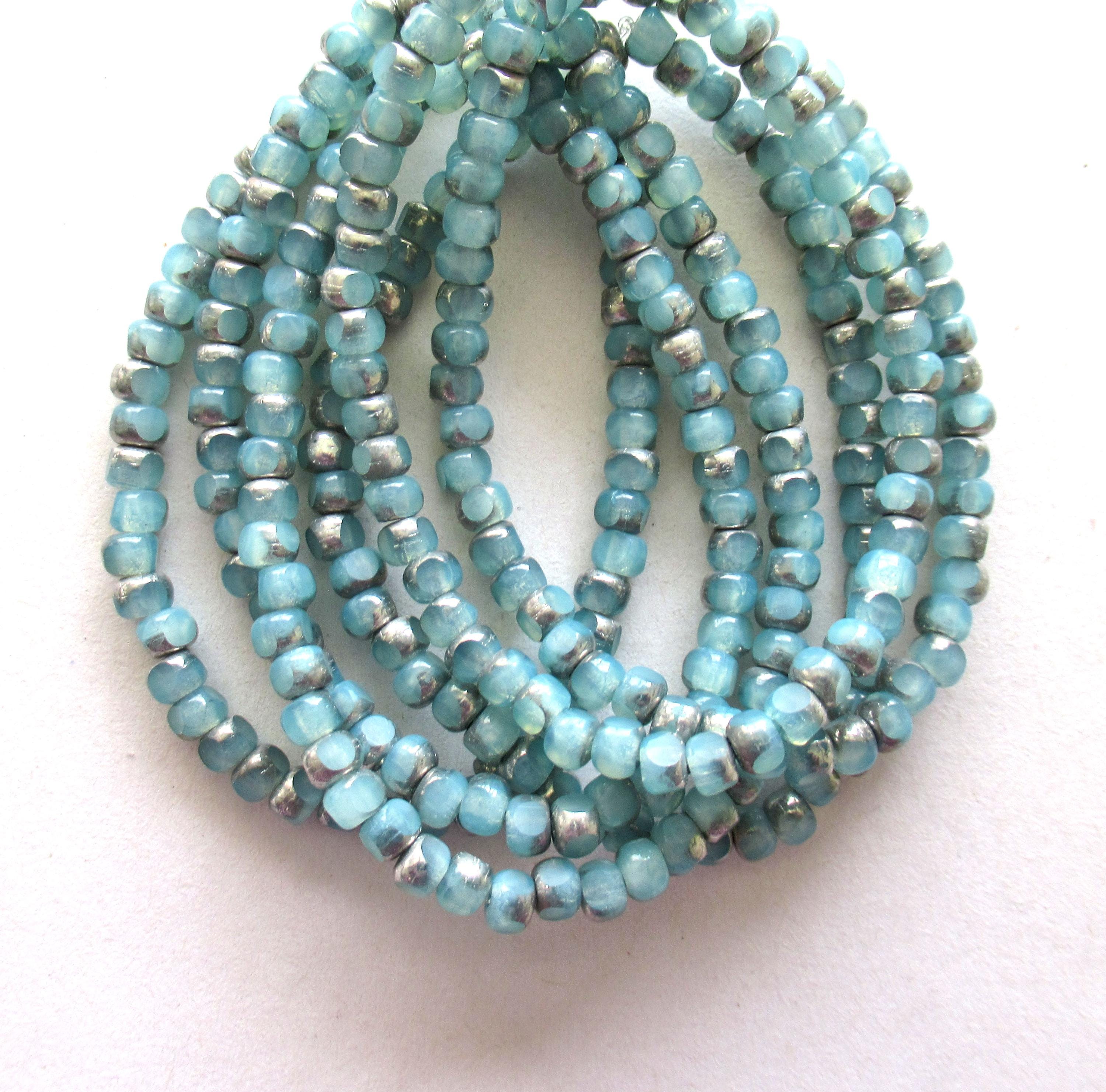 50 Czech glass 6/0 faceted seed beads - translucent ice blue with silver accents - 3 cut - tri-cut 4 x 3mm beads C00911