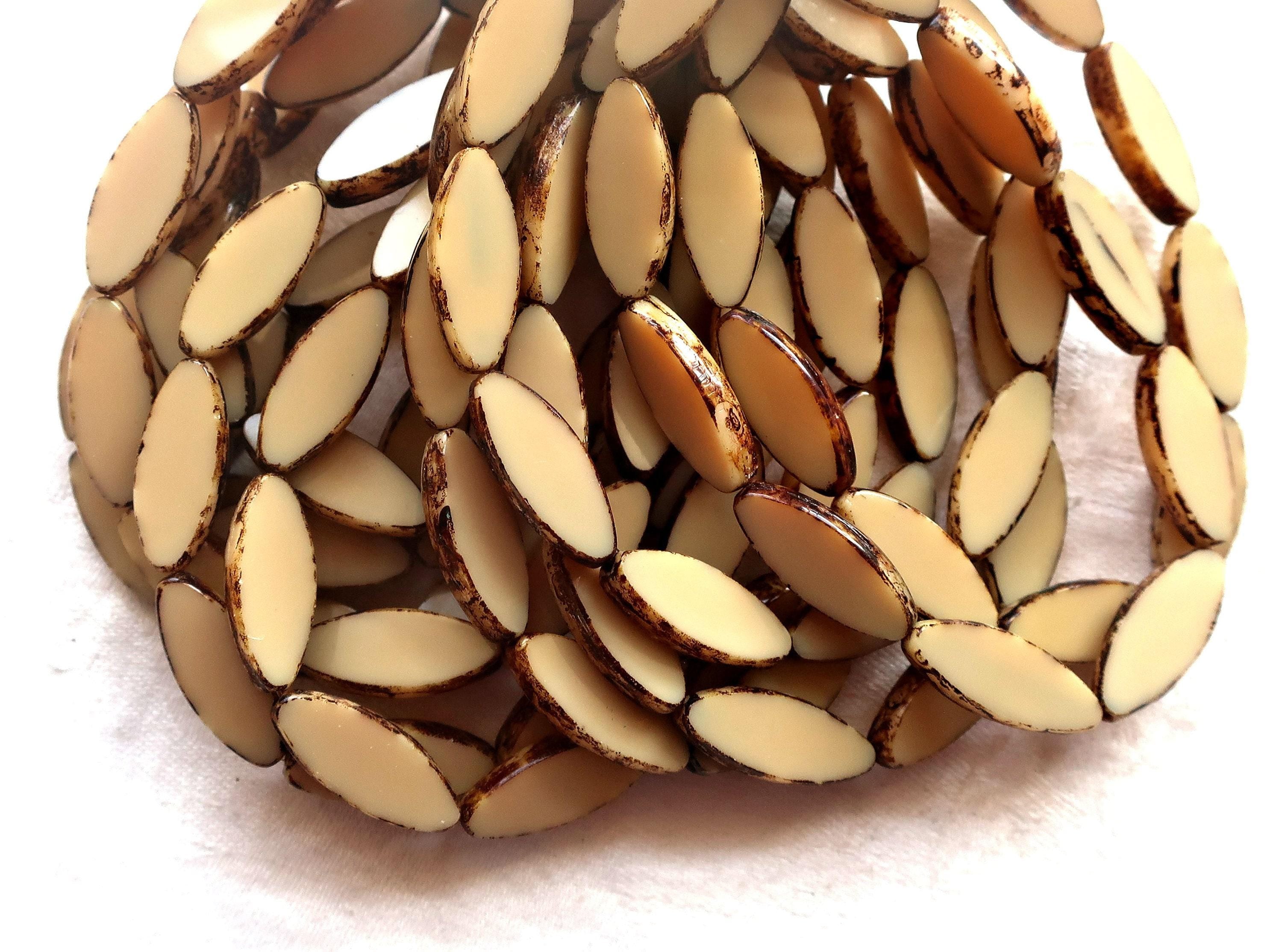 Ten Czech glass spindle beads, 20 x 9mm, neutral opaque beige, off white picasso, table cut, almond or tube shaped beads C76101