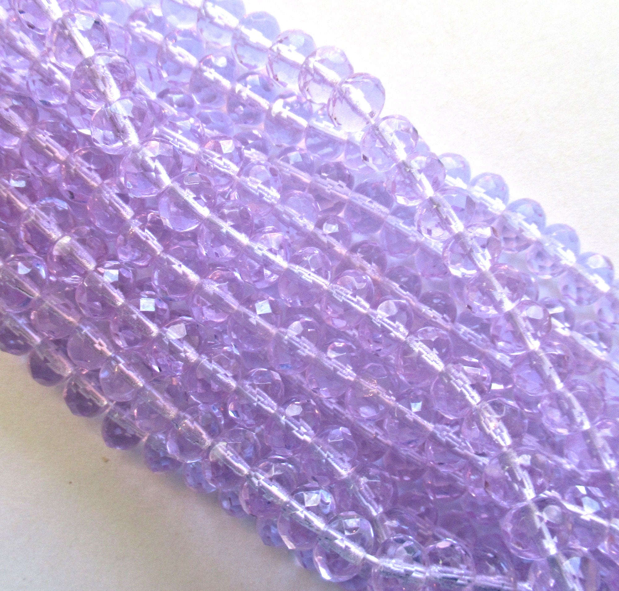 Lot of 25 faceted puffy rondelle or donut beads - 5 x 7mm transparent alexandrite or lavender beads - C0055