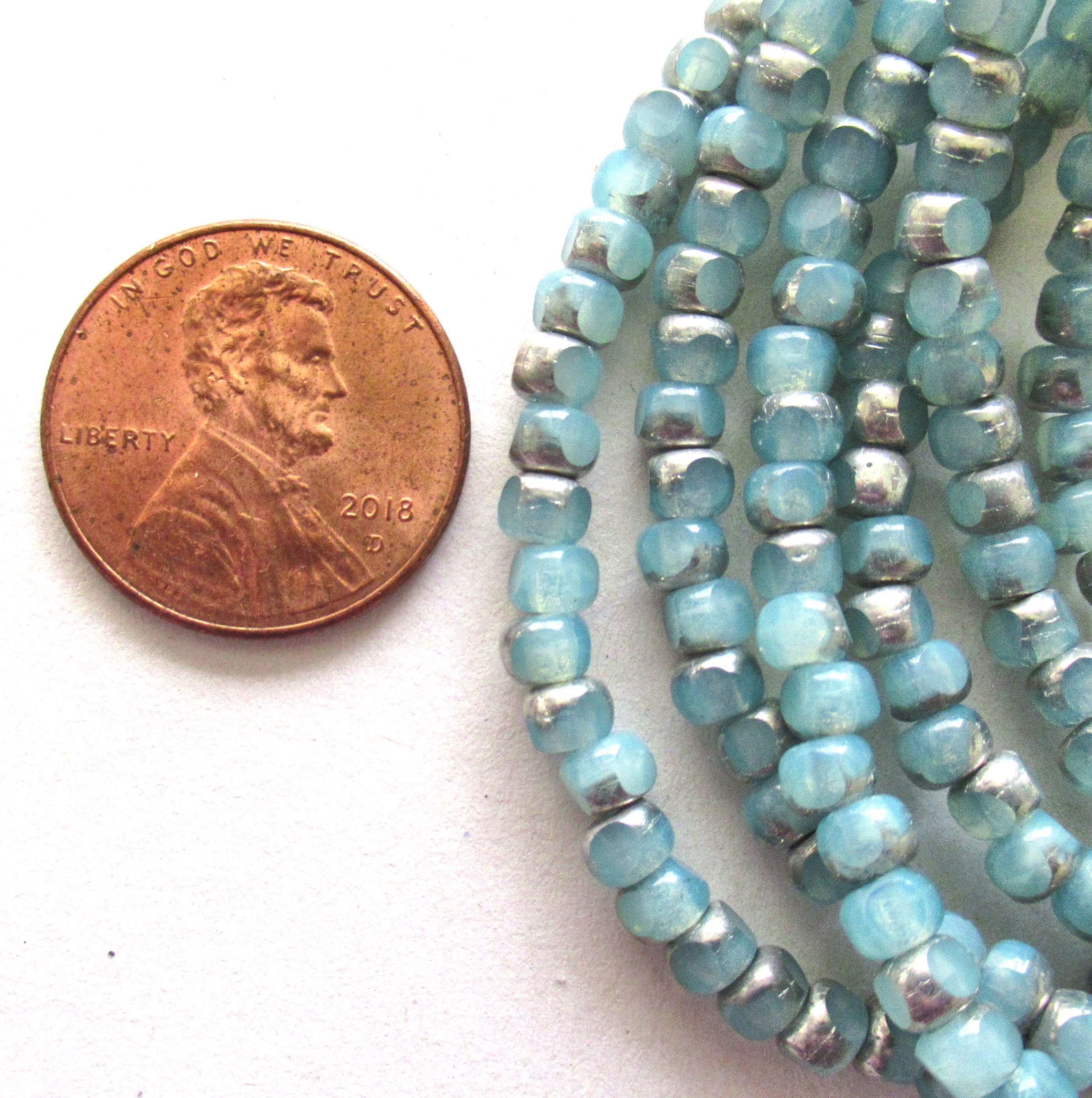 50 Czech glass 6/0 faceted seed beads - translucent ice blue with silver accents - 3 cut - tri-cut 4 x 3mm beads C00911