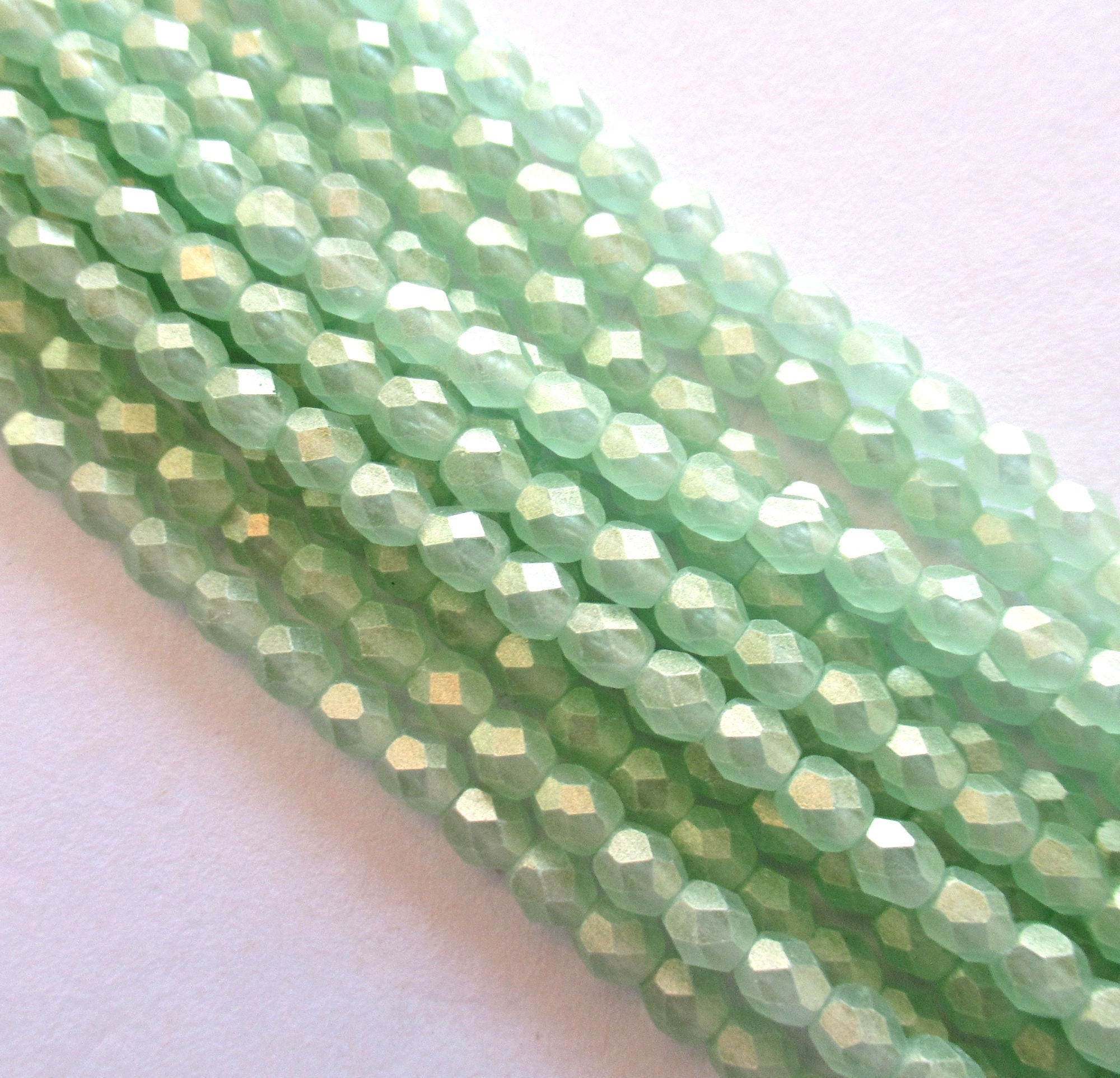 50 4mm faceted Czech glass round beads - Sueded Gold Peirdot - light green with a gold finish fire polished beads - C0024