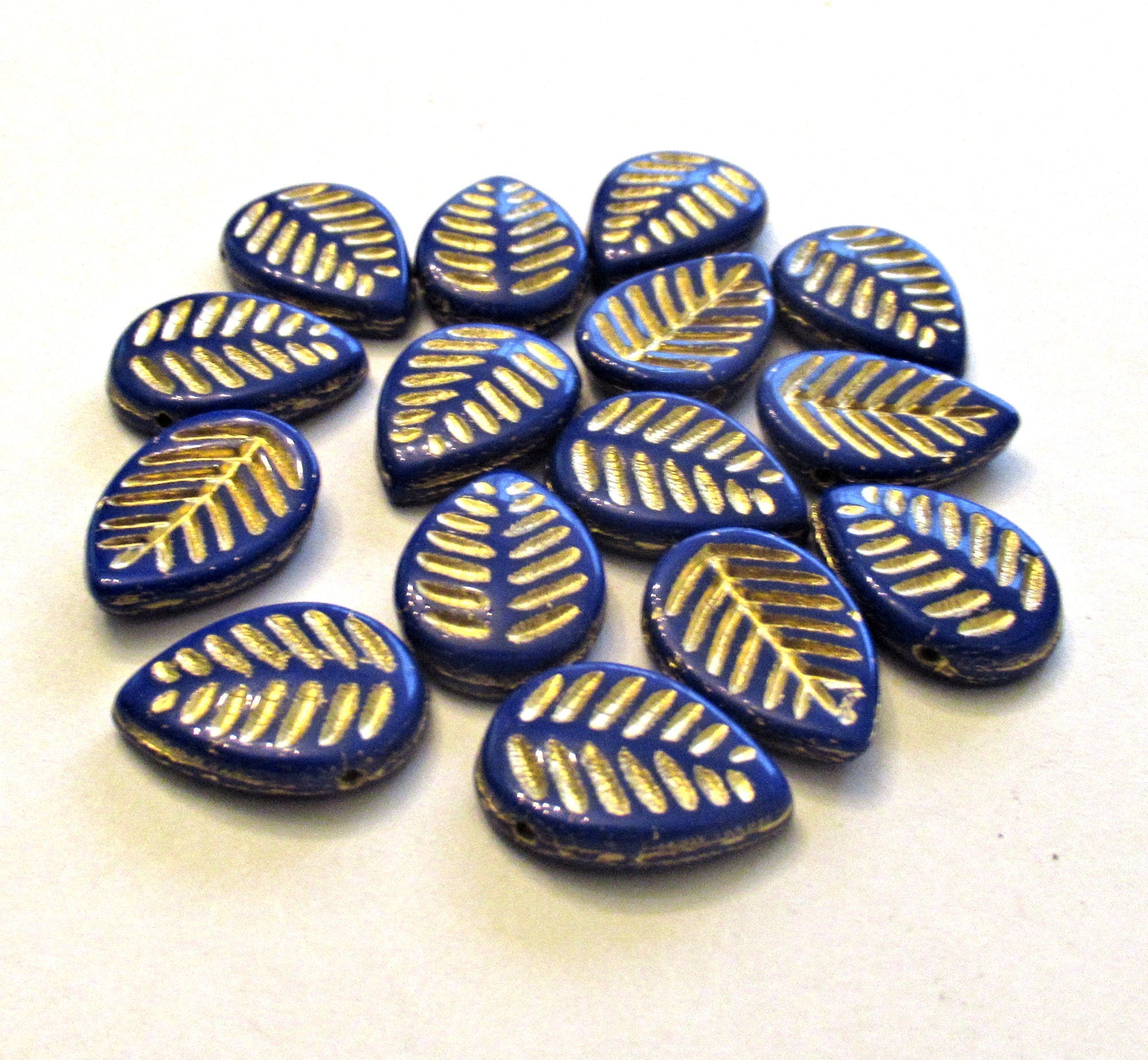 Ten large Czech glass leaf beads - side drilled - opaque royal blue beads with a gold wash - 12 x 16mm carved beads C00041