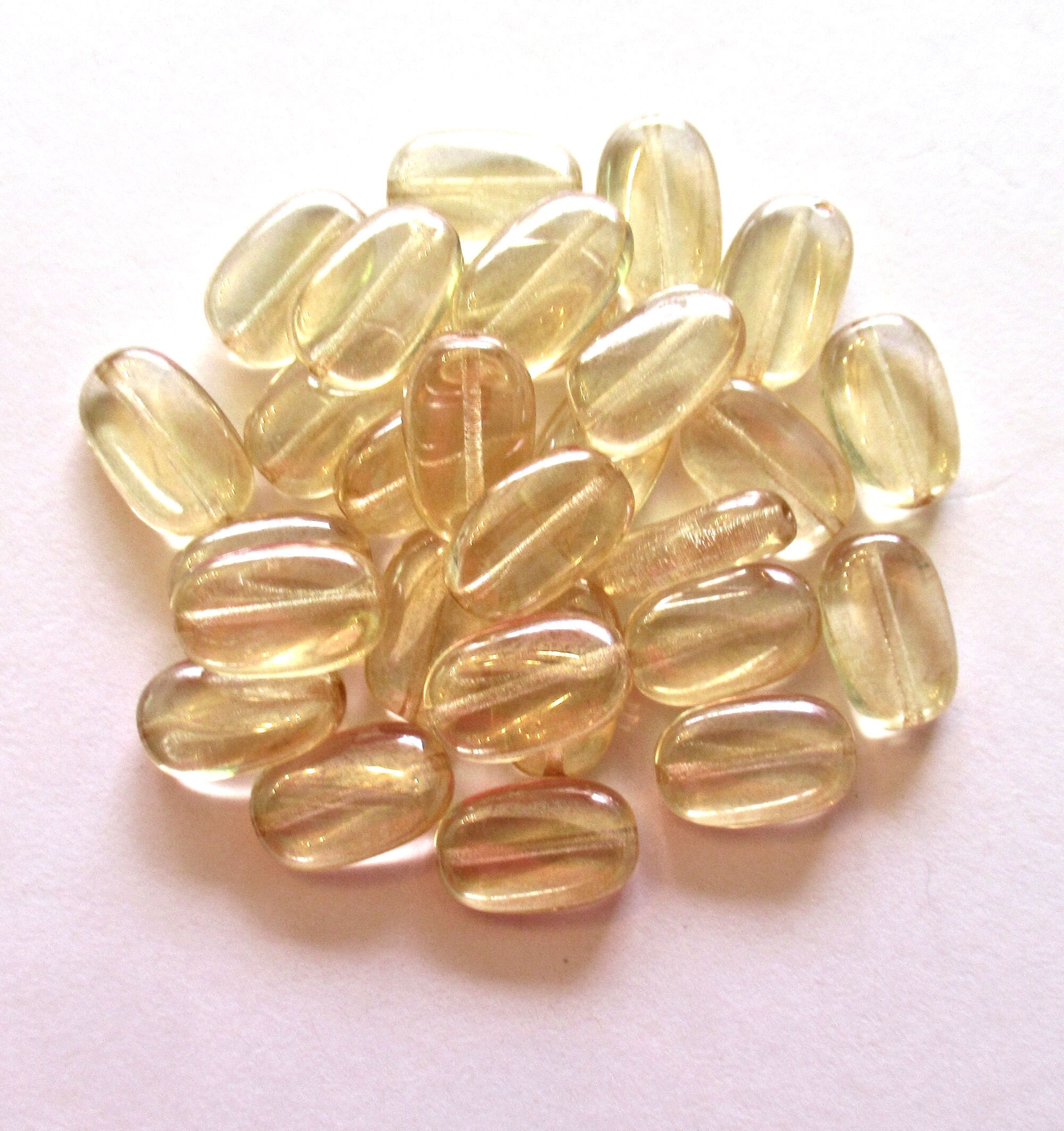 Lot of 15 slightly twisted oval Czech glass beads - 14mm x 8mm champagne - pressed glass beads C0062