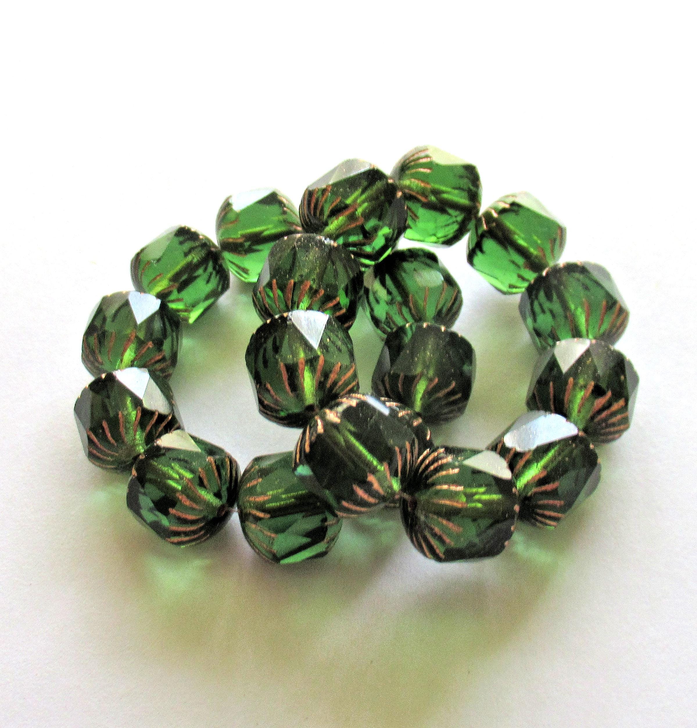 Ten large Czech glass center faceted carved cruller beads - 10mm - round transparent emerald green cathedral beads w/ copper accents - 00063
