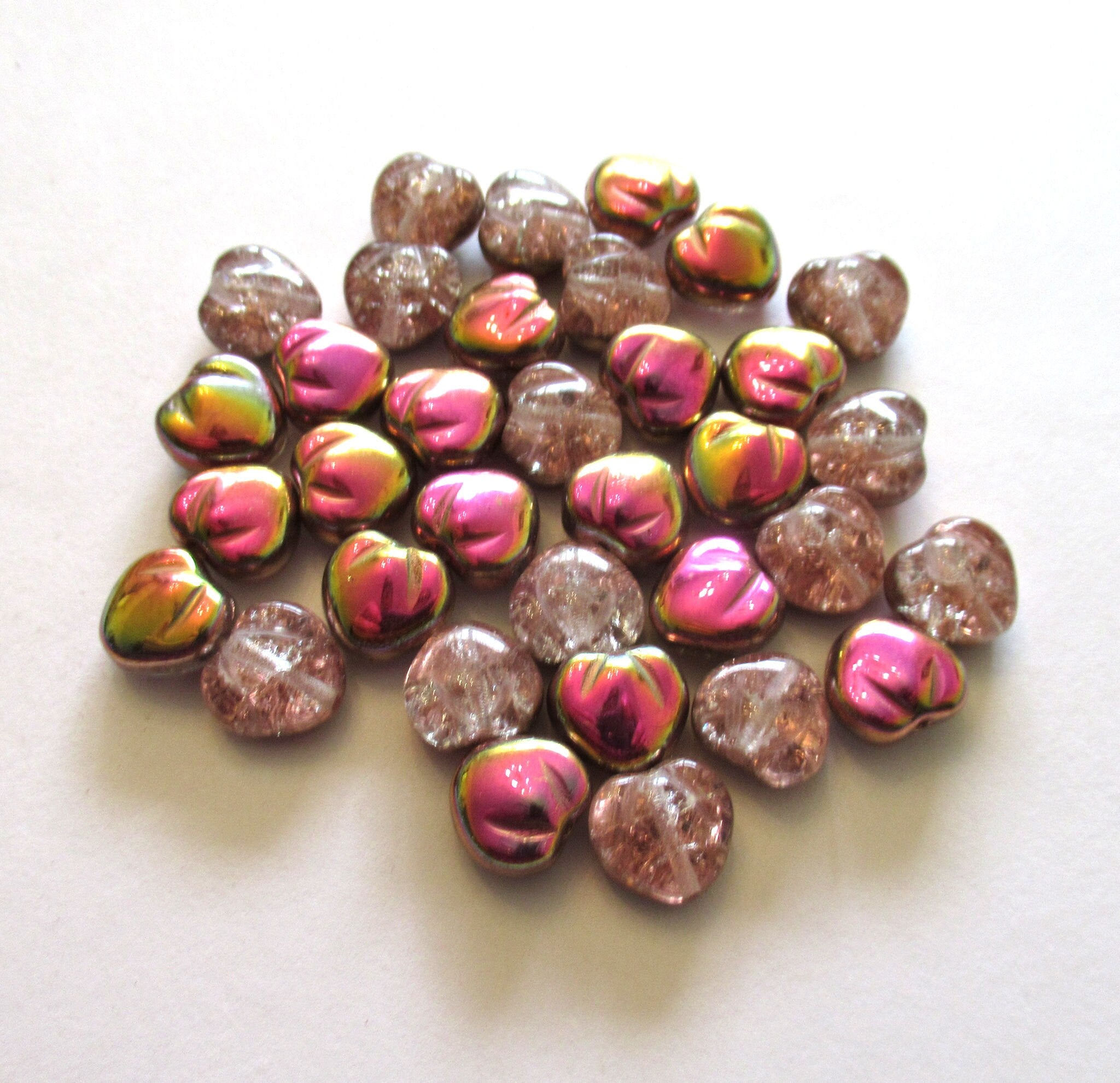 Ten Czech glass heart beads - 11mm pink crackle glass hearts with a pink / gold vitrail finish - C0049