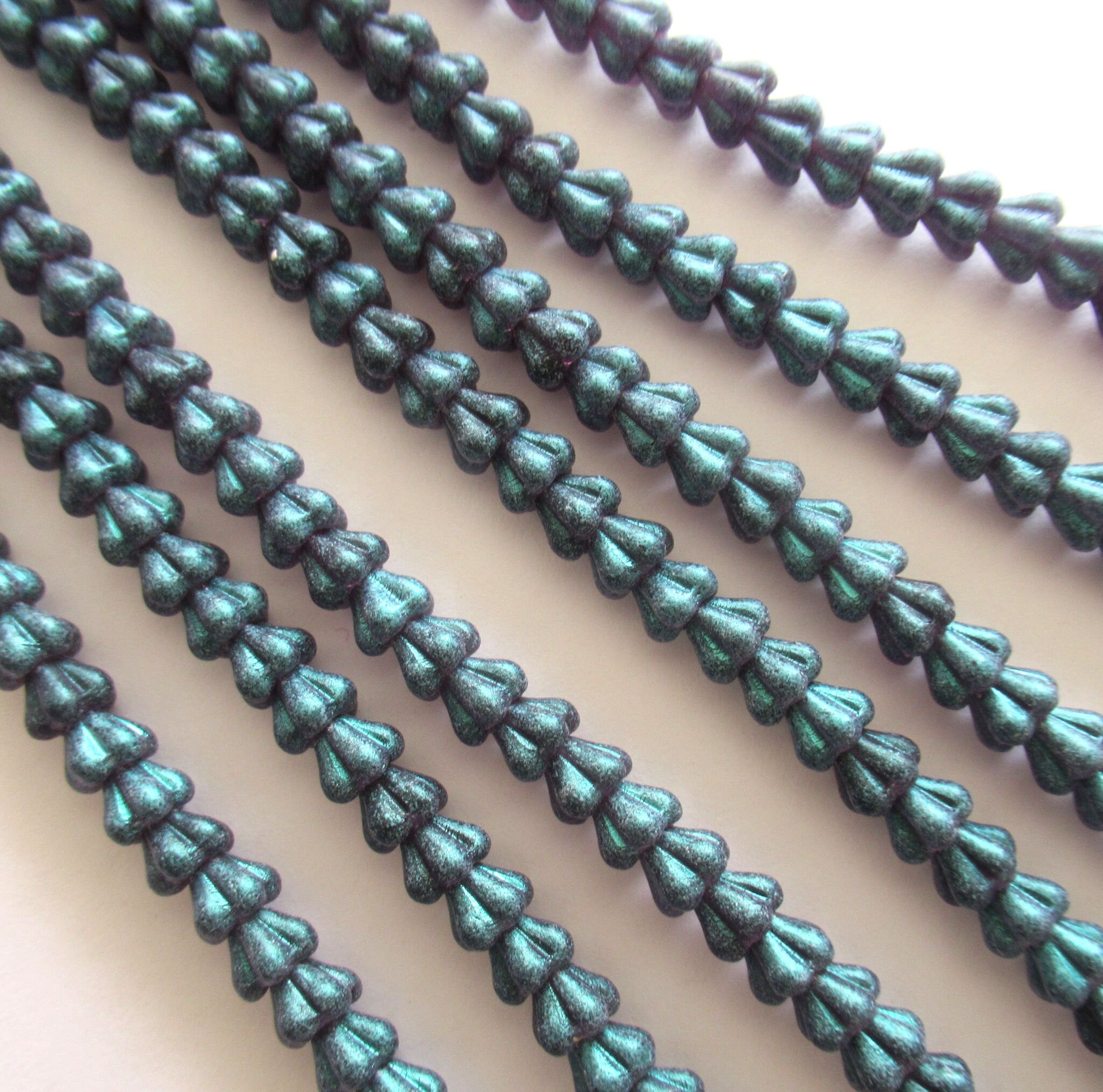 Lot of 50 6mm x 4mm Czech glass baby bell flower beads - green glow tanzanite flower beads - 0069