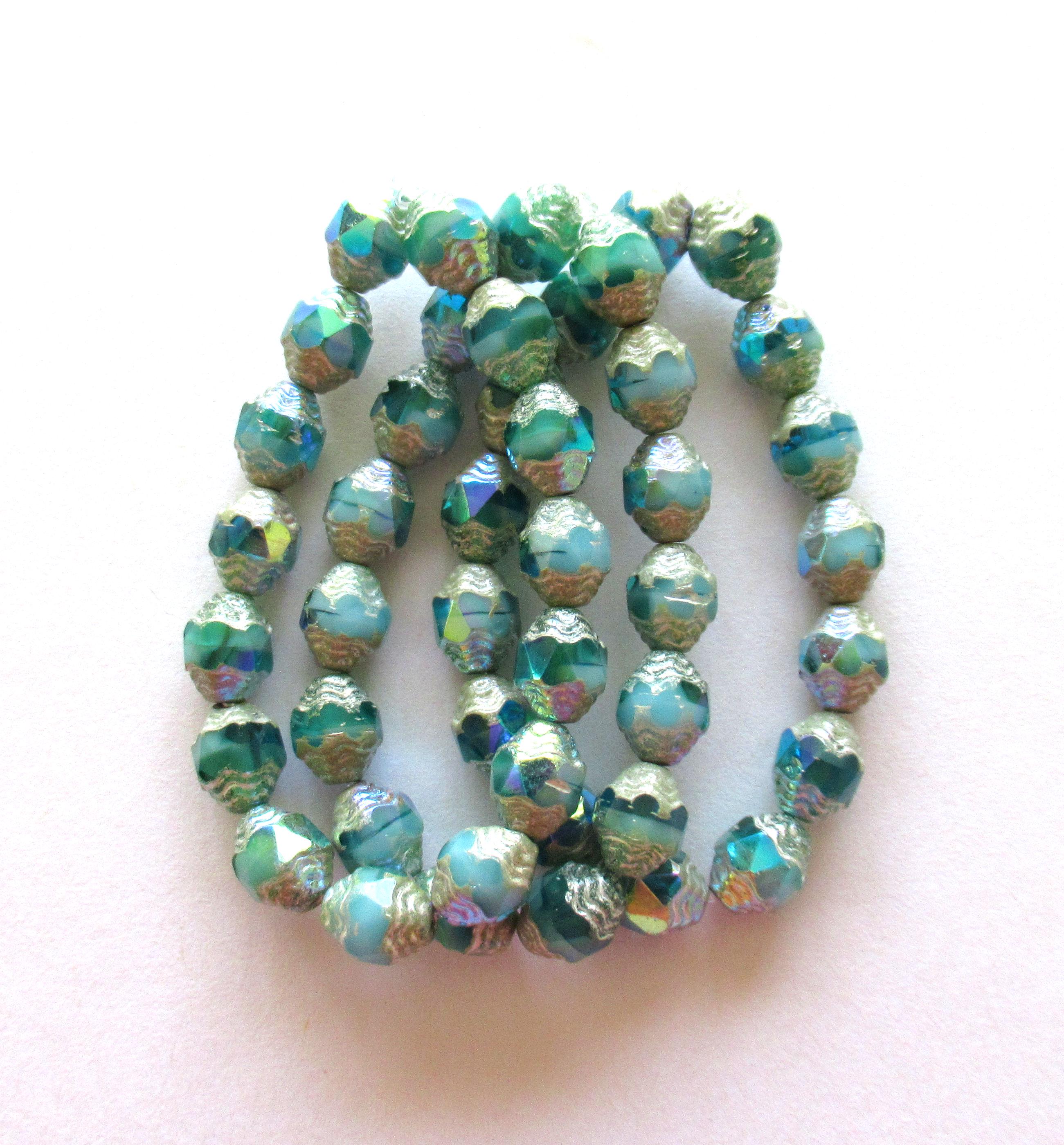 15 Czech glass mini antique style faceted carved oval cathedral beads - 8 x 6mm - opaque & transparent blue green ab w/ silver accents - C000572