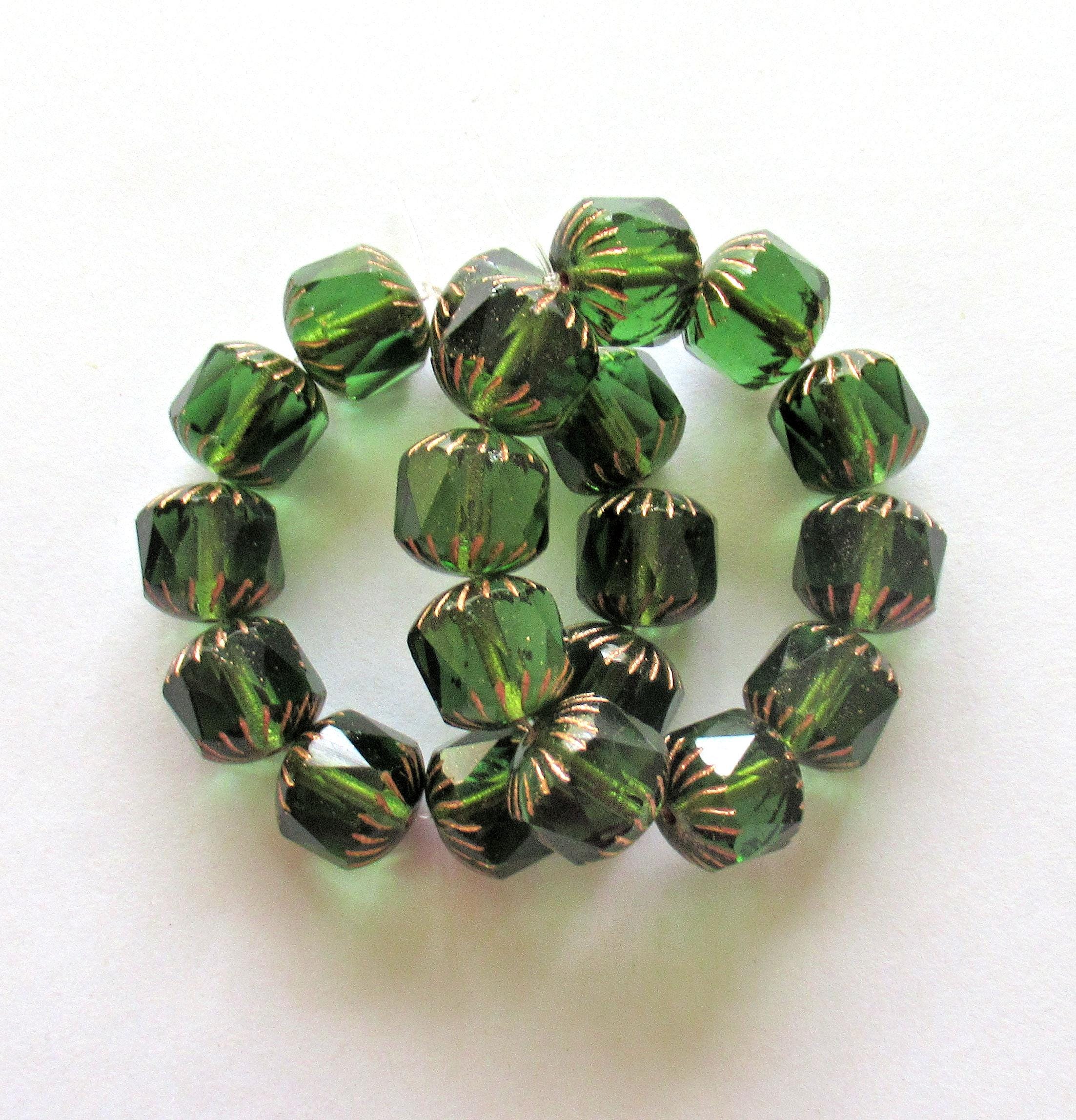 Ten large Czech glass center faceted carved cruller beads - 10mm - round transparent emerald green cathedral beads w/ copper accents - 00063
