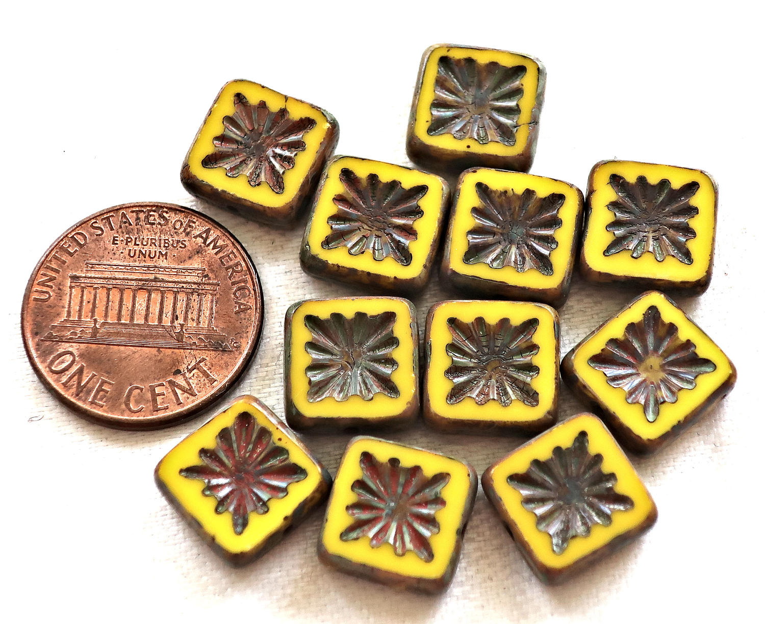 Ten 10mm x 10mm square opaque yellow carved, table cut, picasso Czech glass beads, front and back carved C6701