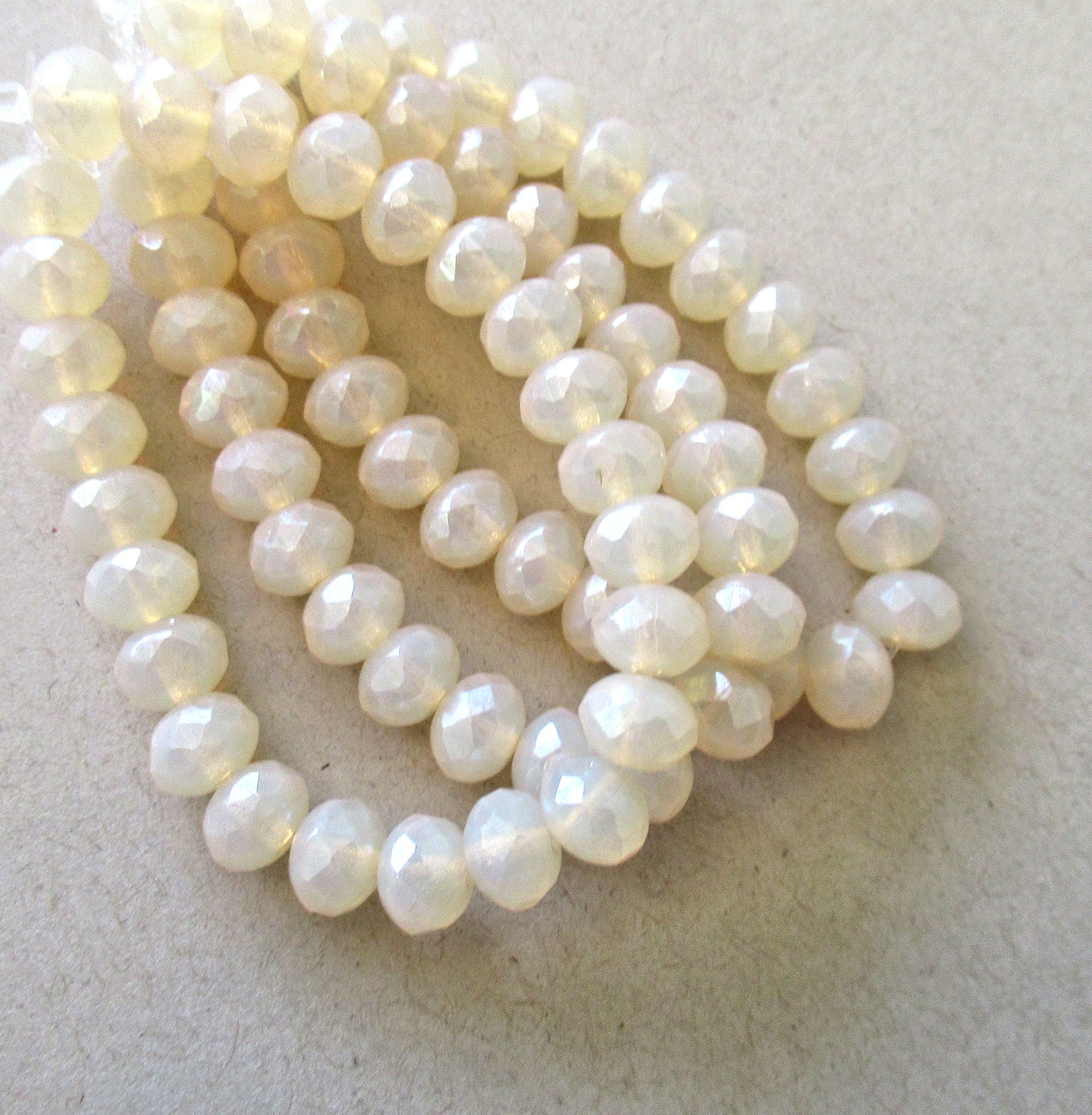 Lot of 25 Czech glass puffy rondelles - translucent beige / off white / milky opalite - 5 x 7mm faceted rondelles 00641