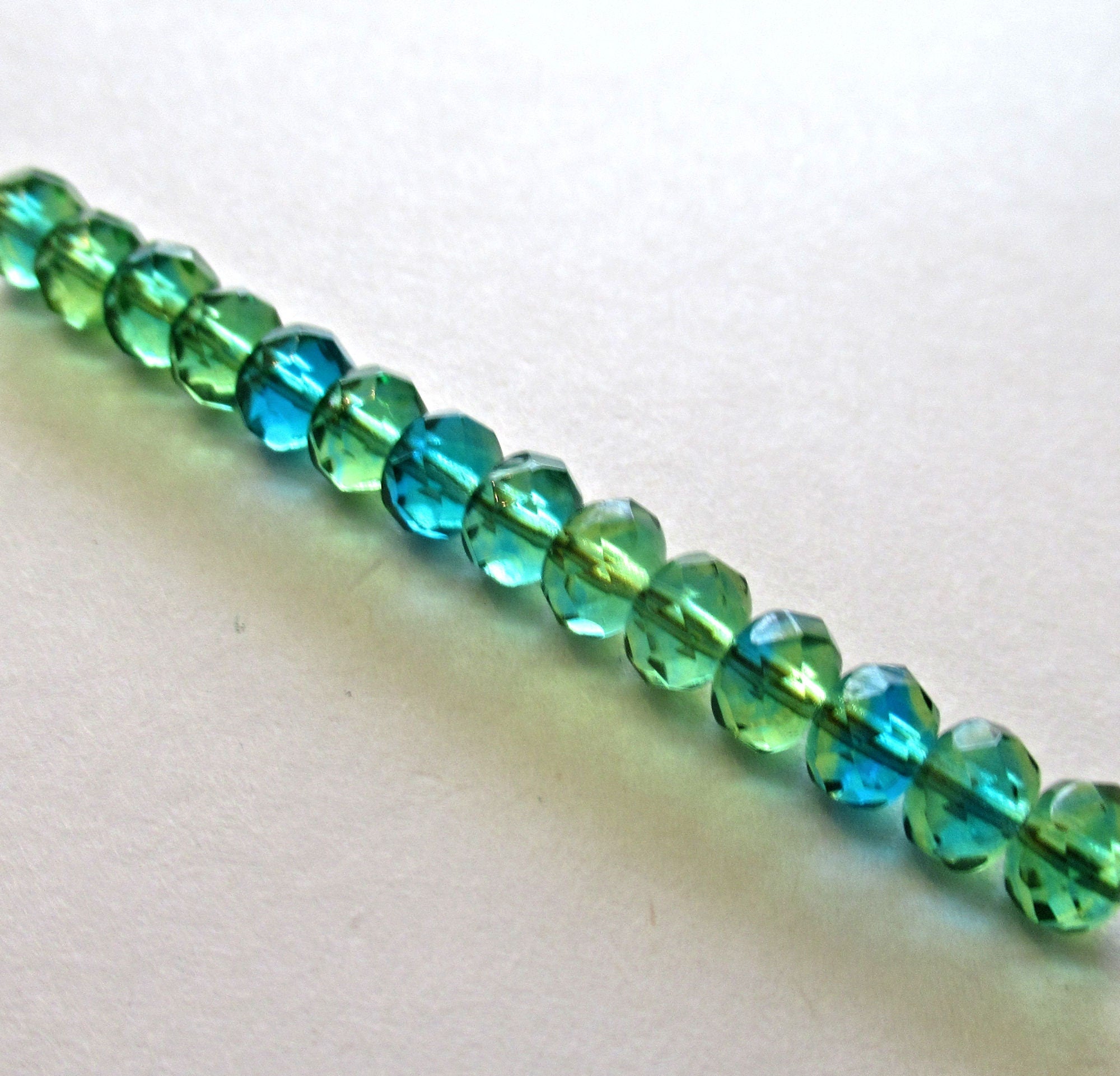 25 faceted Czech glass puffy rondelle beads - 5 x 7mm transparent green and blue mix rondelles - faceted fire polished beads - 00051