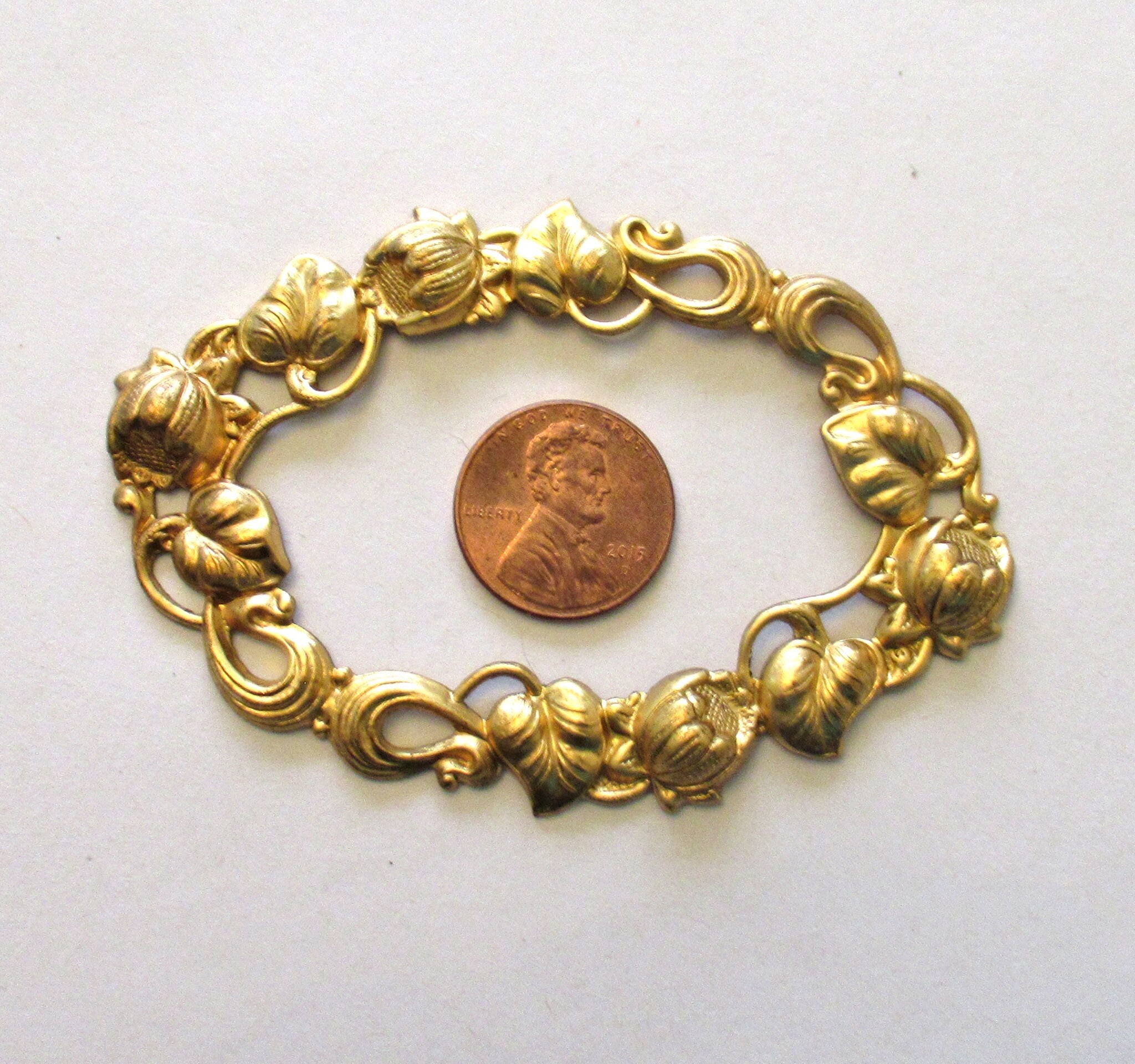 1 large oval brass stamping frame - Ornate Victorian ornament - component - 3.125" x 2.125" made in the USA C00271