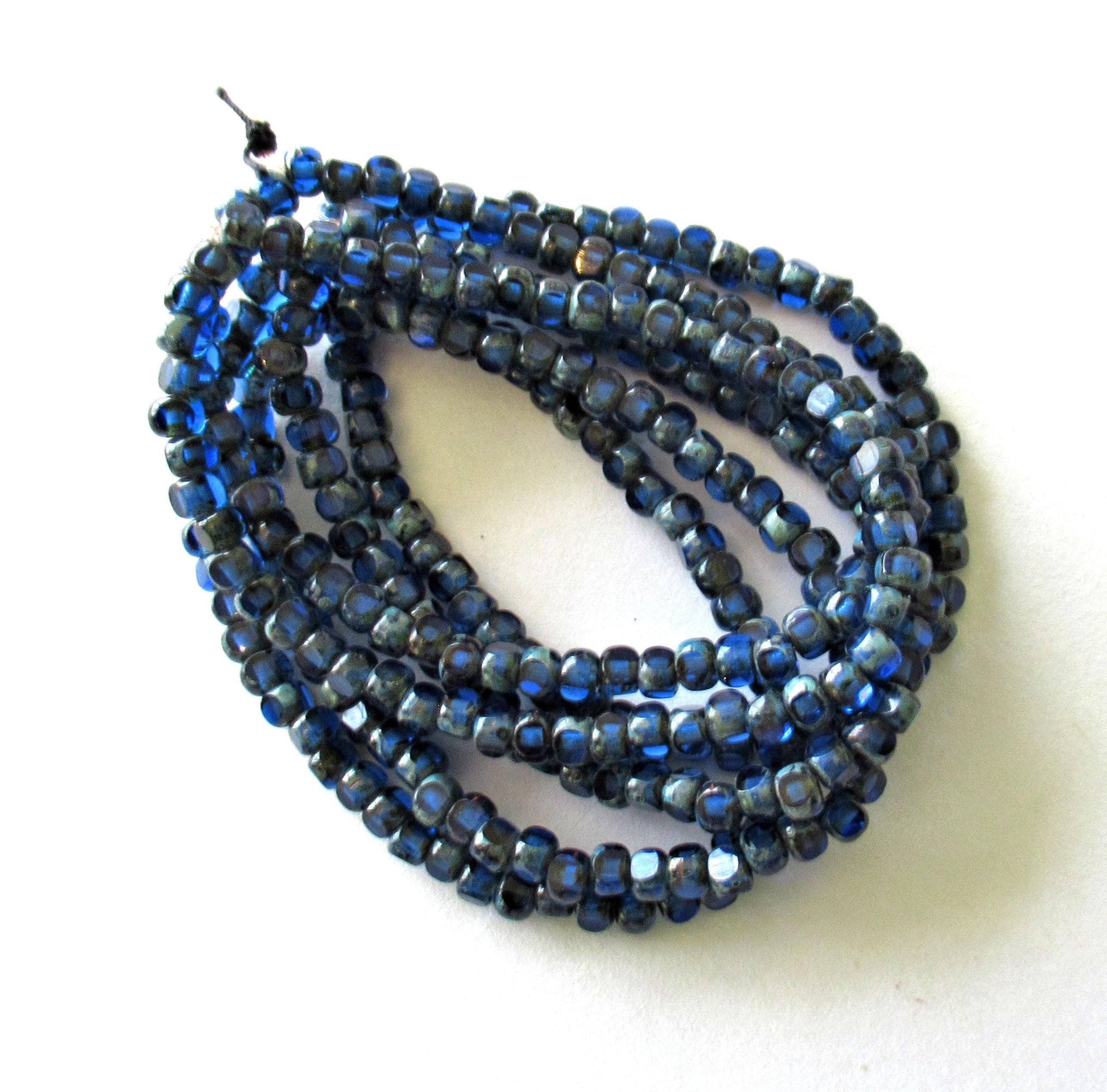 50 Czech glass 6/0 faceted seed beads - transparent sapphire blue with picasso accents - 3 cut - tri-cut - 4 x 3mm beads - C00041