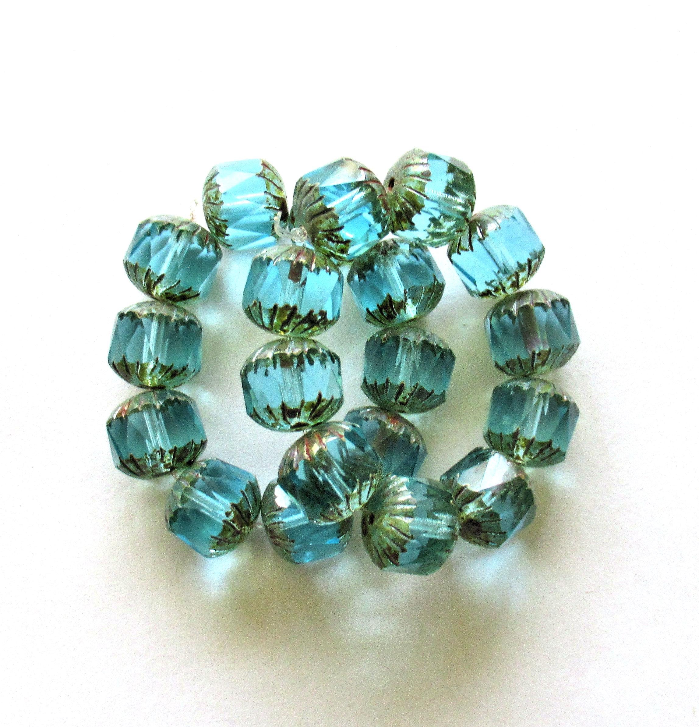 Ten Czech glass faceted carved cruller beads - 10mm - transparent aqua blue - cathedral beads w/ picasso accents on the ends - 00004