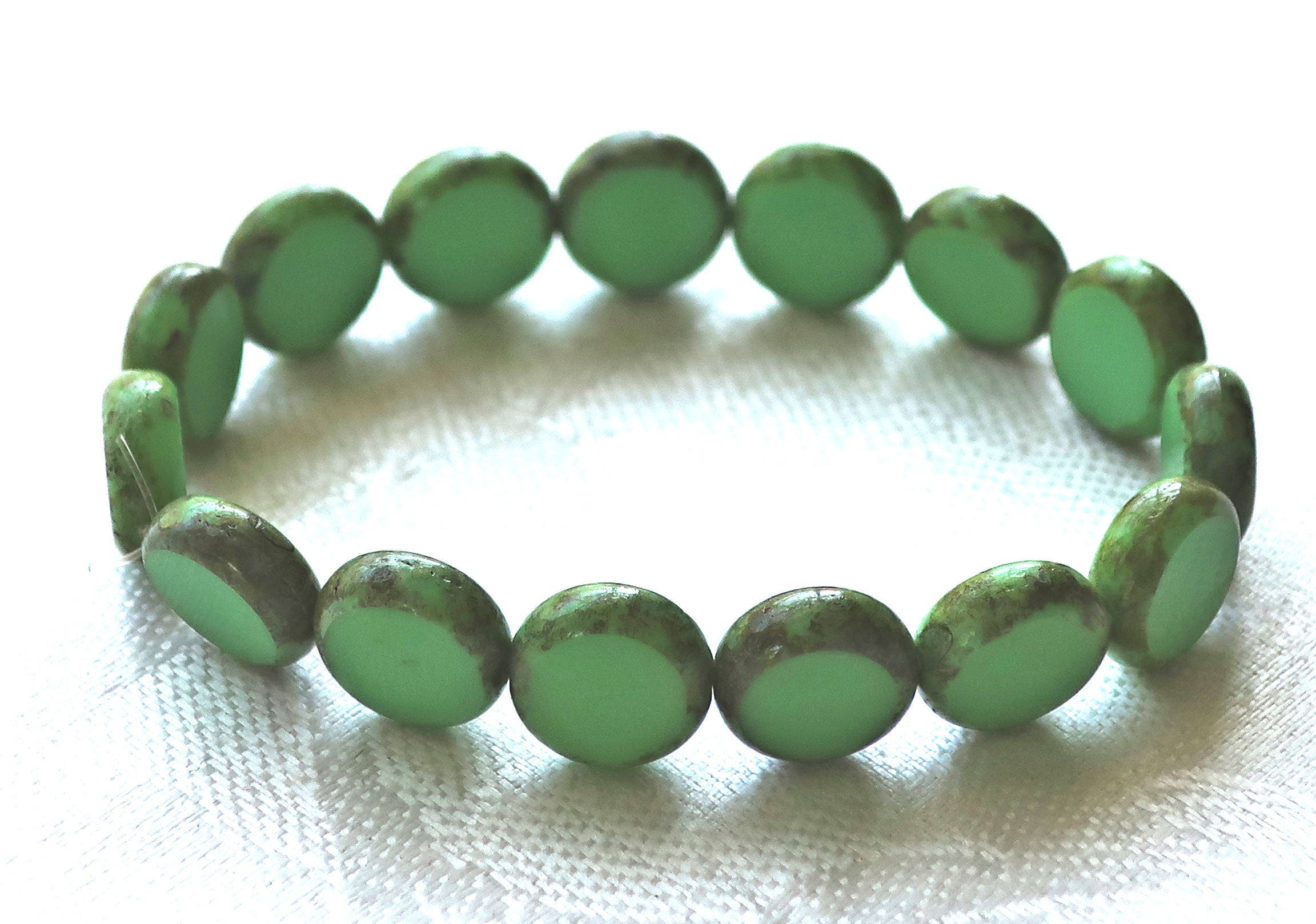 10 Czech glass green coin or disc beads - 11mm flat round beads - opaque light green table cut beads with a picasso finish 02201