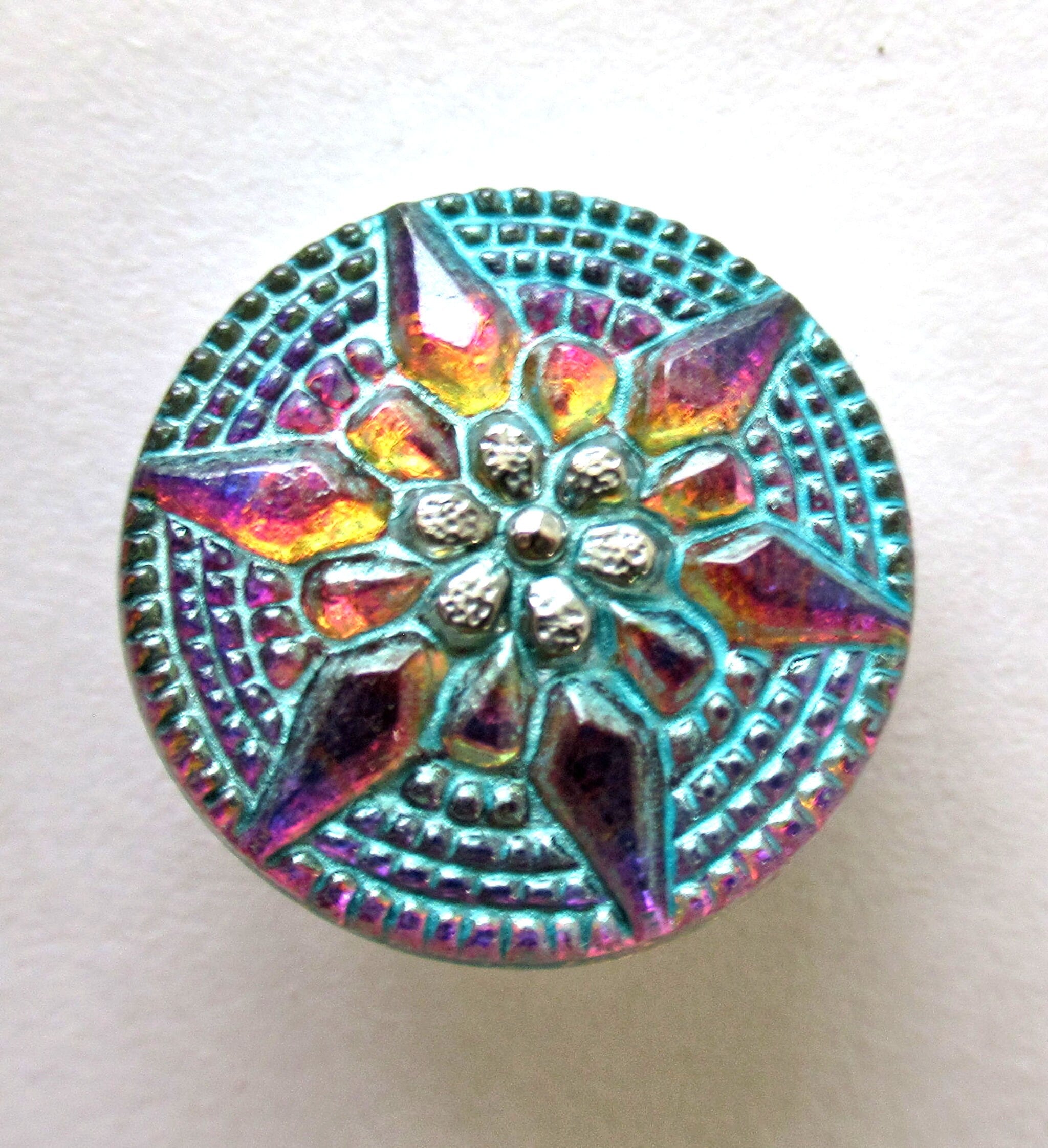 One 18mm Czech art glass button - multicolored gold raised star with a turquoise wash - verdigris look decorative shank button 00432