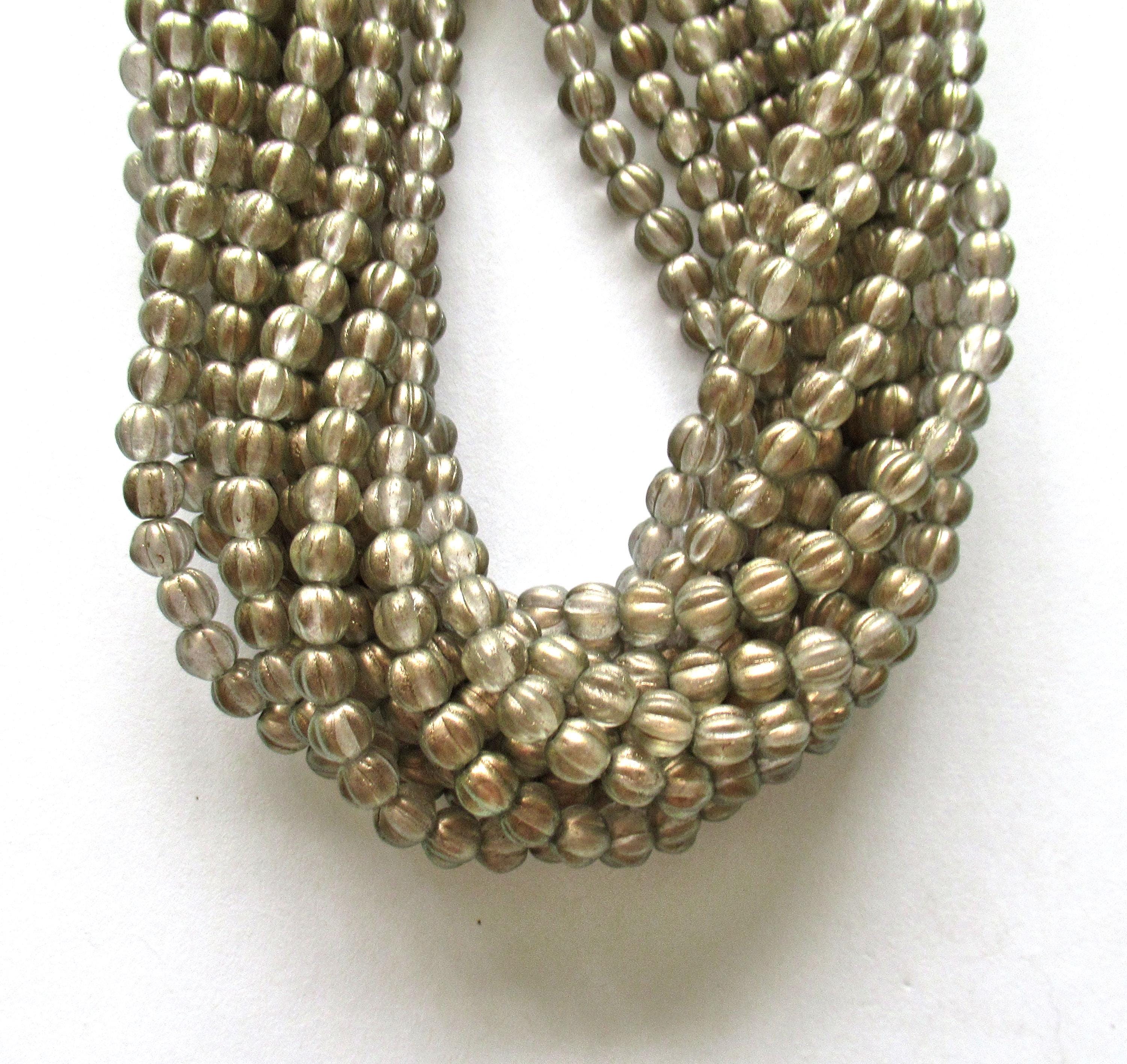 Fifty 5mm Czech glass melon beads - Halo Linen beads - neutral clear beads with a gold finish - C00201