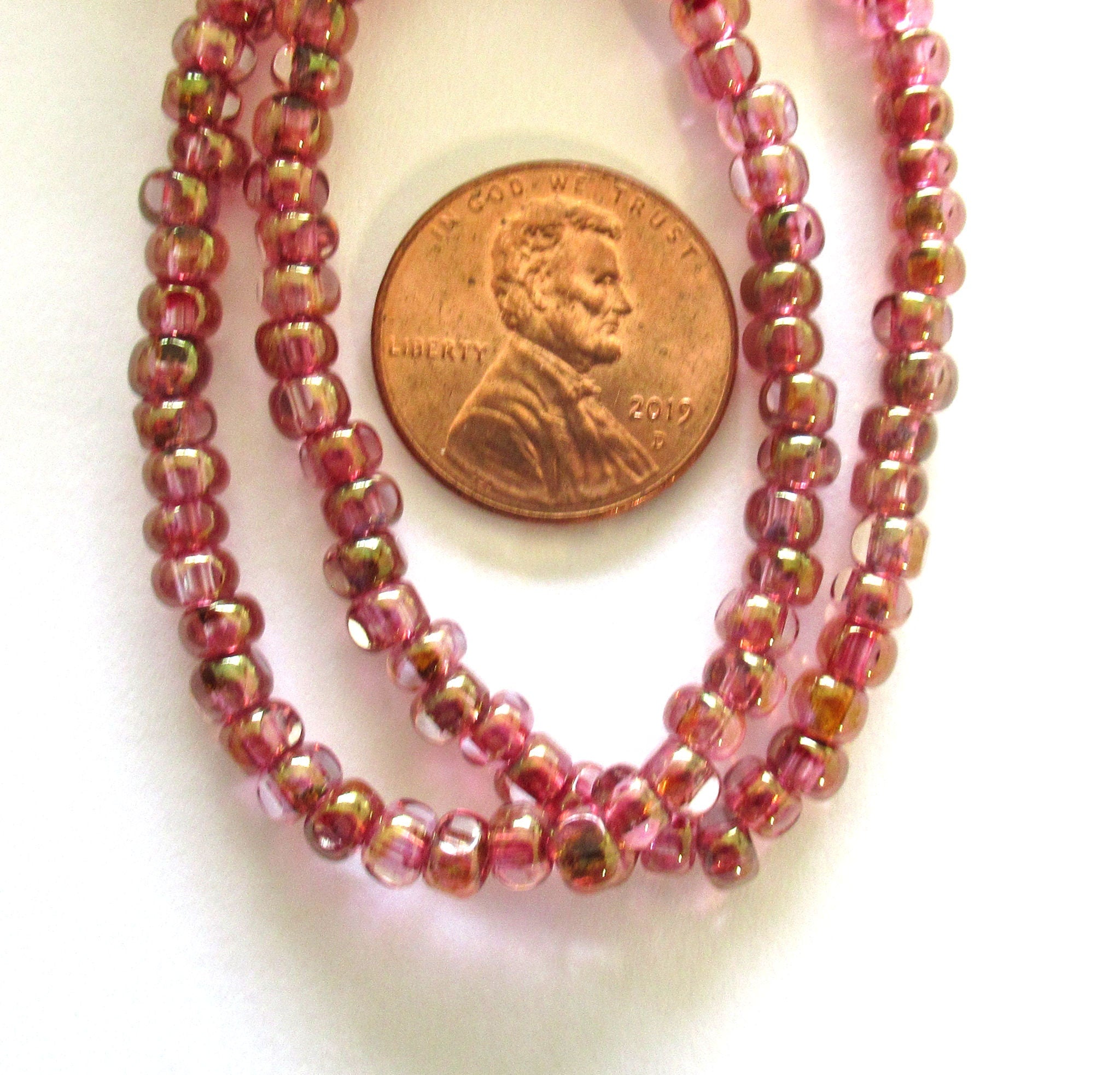 Fifty 6/0 faceted Czech glass seed beads -transparent pink with a gold luster finish seed beads C0099