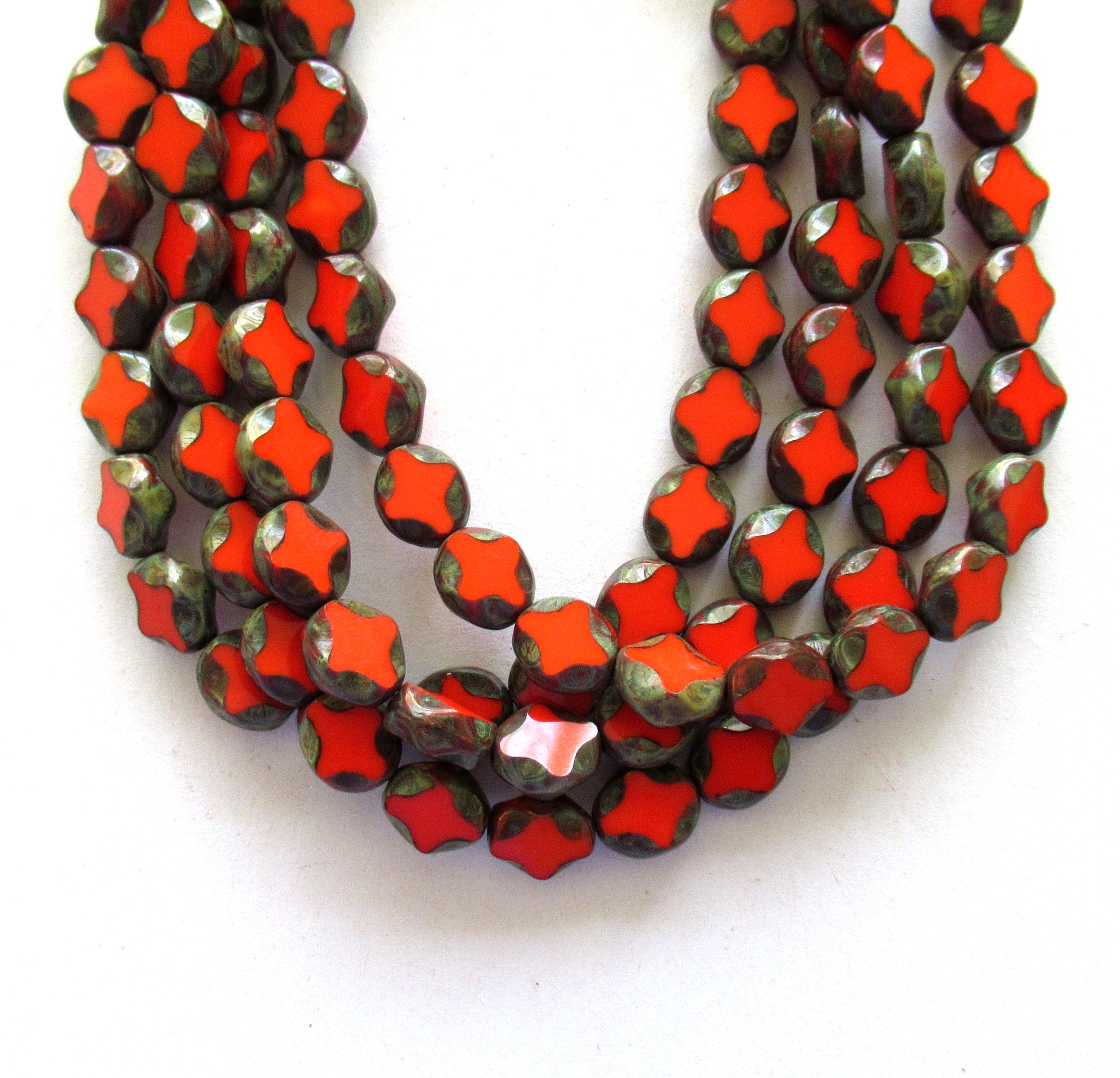 15 Czech glass oval beads - 9 x 8mm - coral red oval with a Picasso finish - carved table cut beads with a diamond pattern - C0251