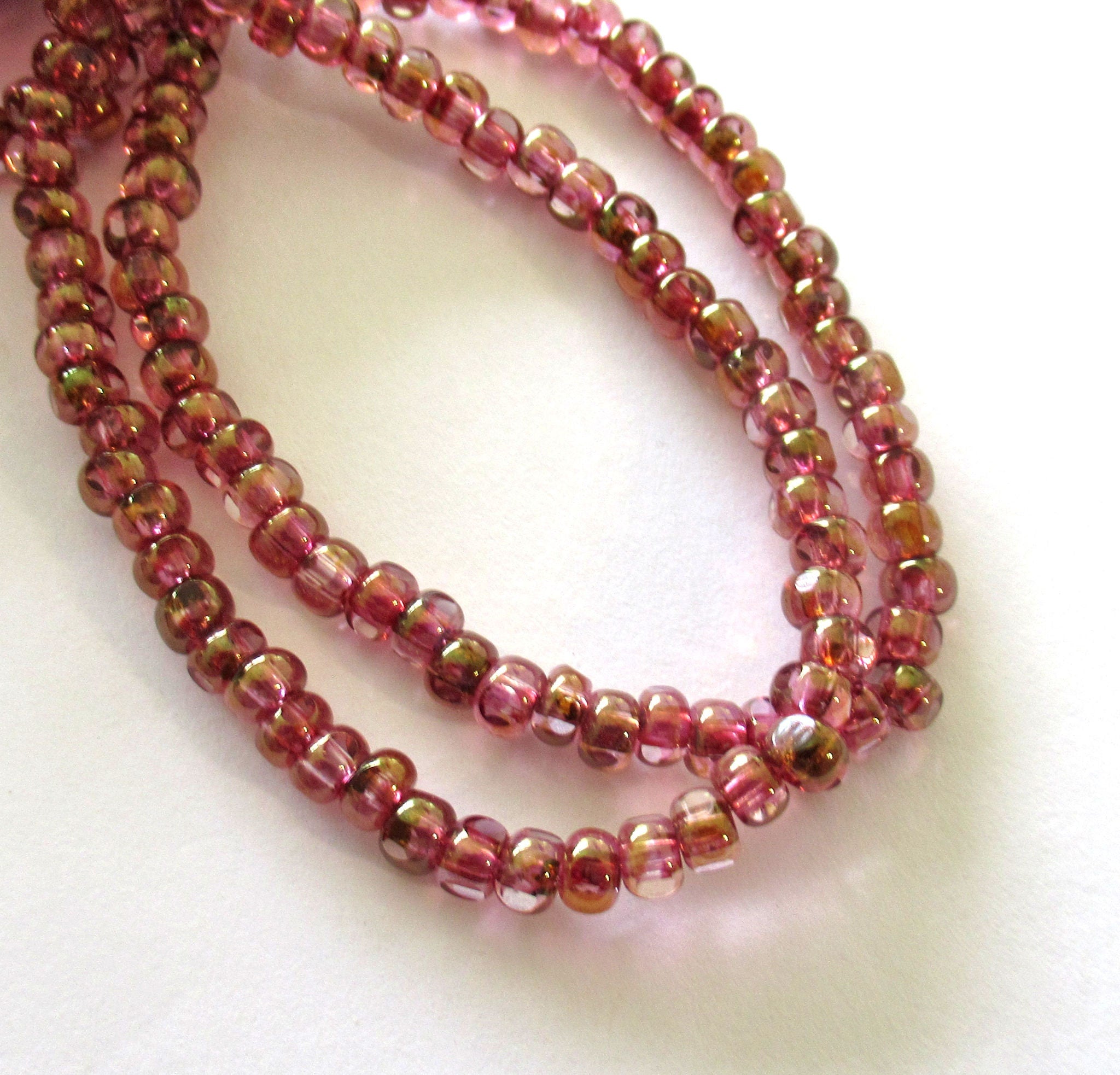 Fifty 6/0 faceted Czech glass seed beads -transparent pink with a gold luster finish seed beads C0099