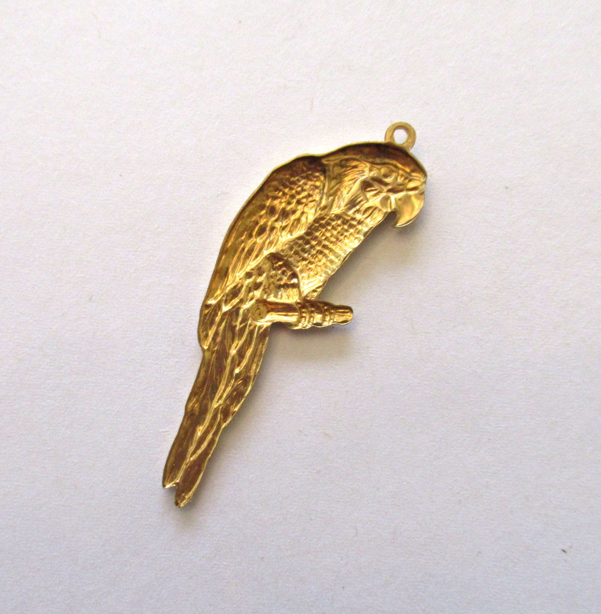1 large raw brass bird stamping - parrot parakeet pendant - charm - ornament 2" x .75" inches - made in the USA C0017