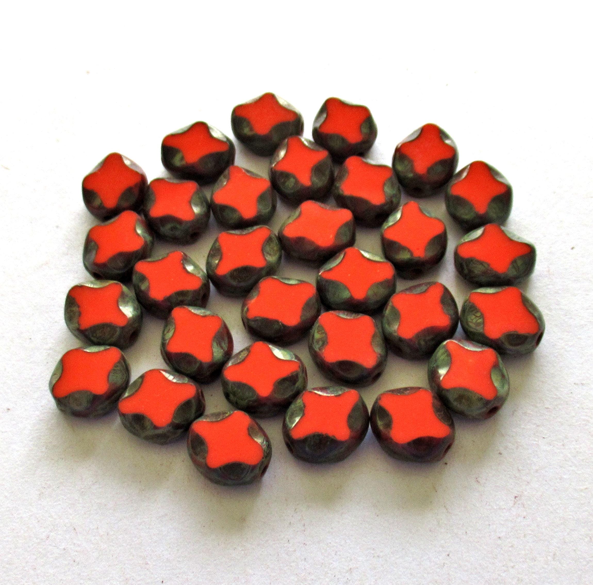 15 Czech glass oval beads - 9 x 8mm - coral red oval with a Picasso finish - carved table cut beads with a diamond pattern - C0251