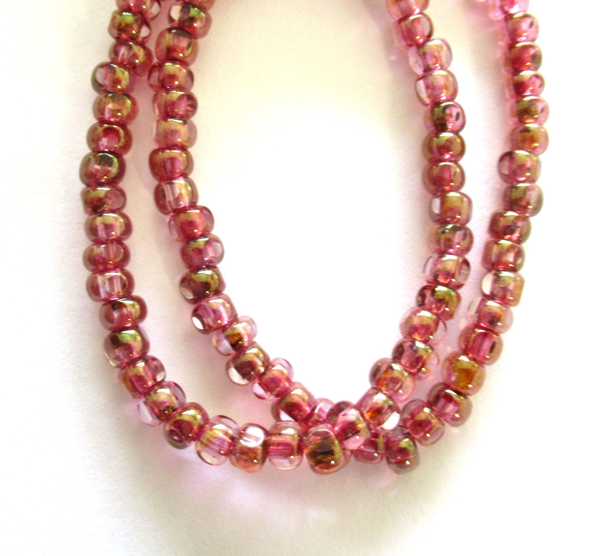 Fifty 6/0 faceted Czech glass seed beads -transparent pink with a gold luster finish seed beads C0099
