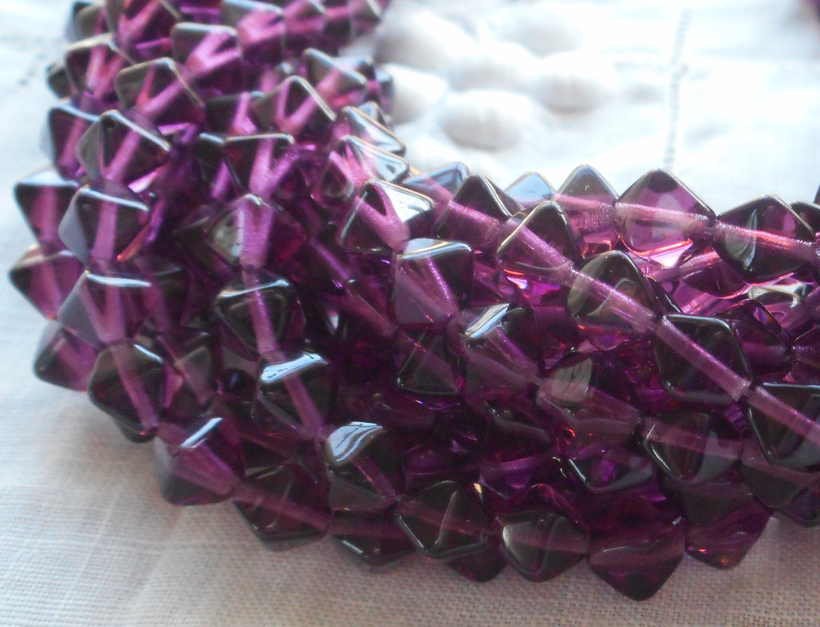 Fifty 6mm Amethyst bicones, Purple pressed glass Czech bicone beads C7501