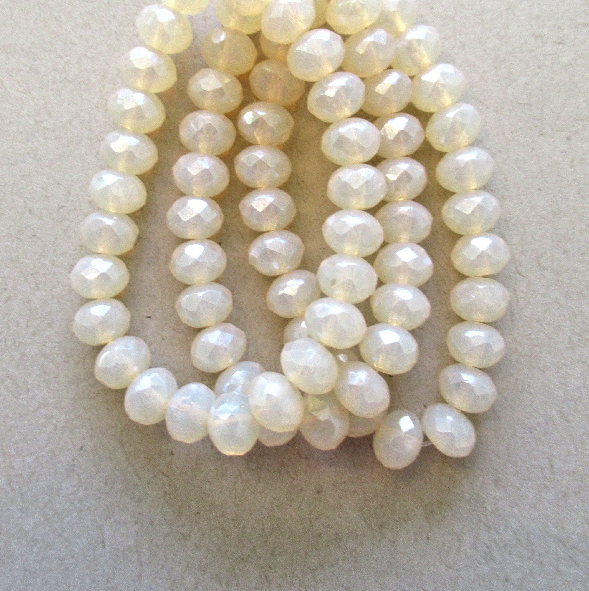 Lot of 25 Czech glass puffy rondelles - translucent beige / off white / milky opalite - 5 x 7mm faceted rondelles 00641