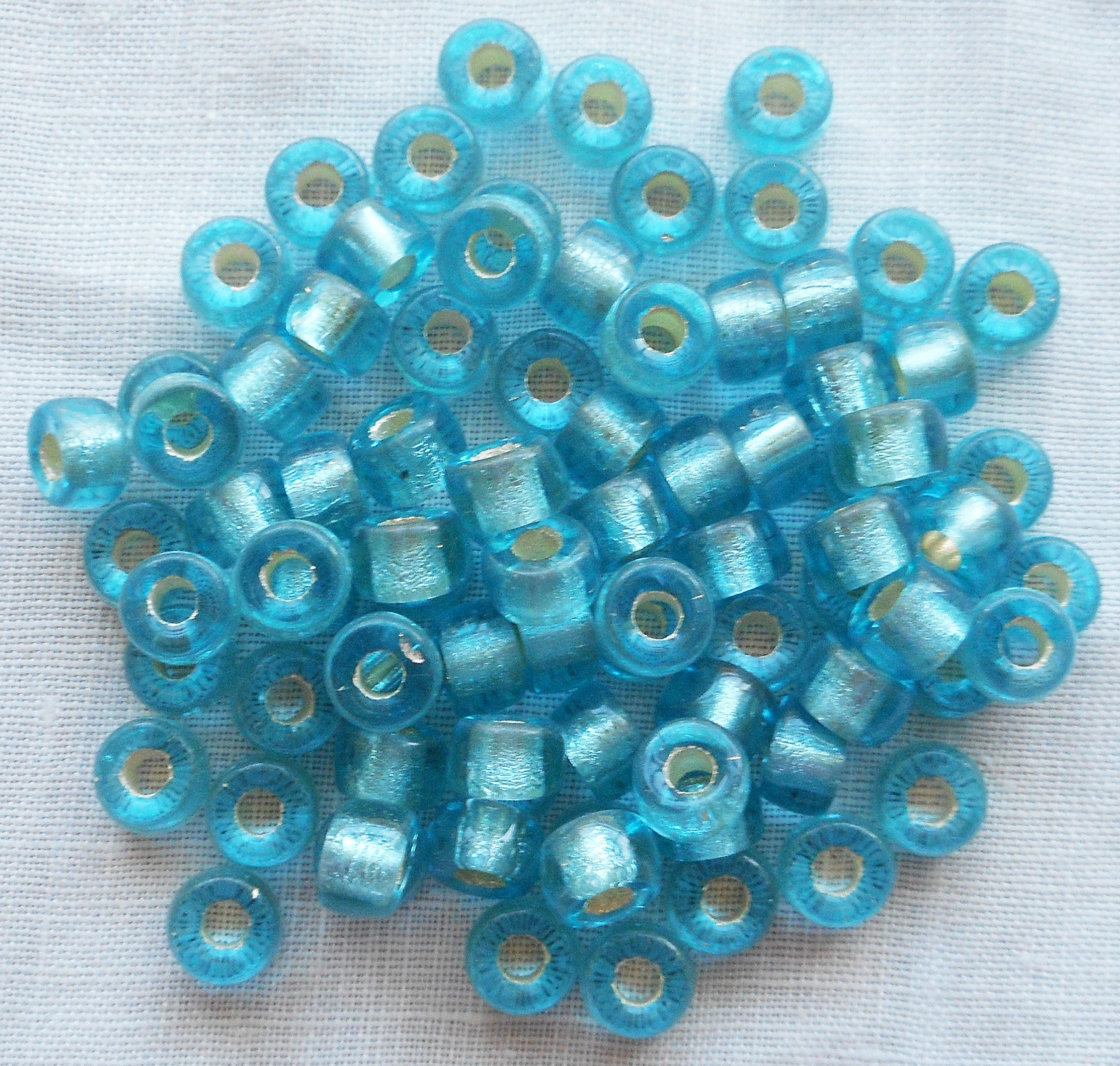Fifty 6mm aqua blue silver lined Czech glass pony, roller beads, large hole crow beads C5401