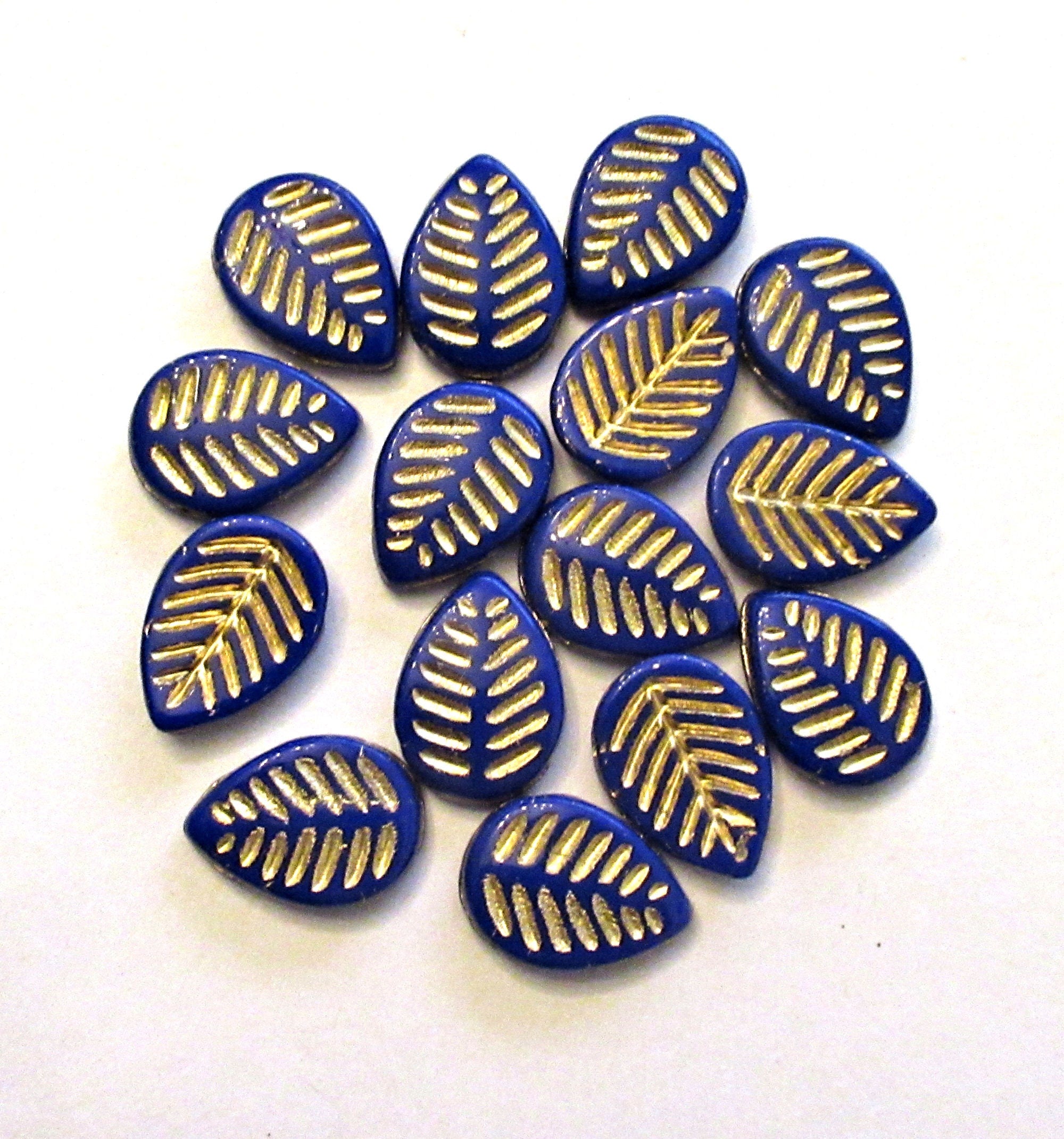 Ten large Czech glass leaf beads - side drilled - opaque royal blue beads with a gold wash - 12 x 16mm carved beads C00041