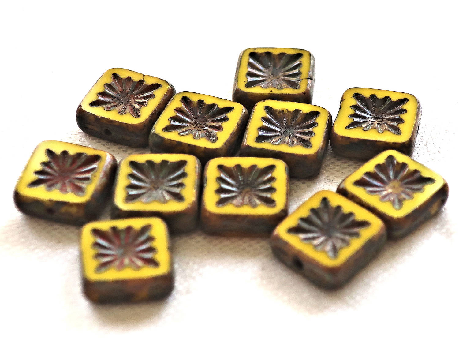 Ten 10mm x 10mm square opaque yellow carved, table cut, picasso Czech glass beads, front and back carved C6701