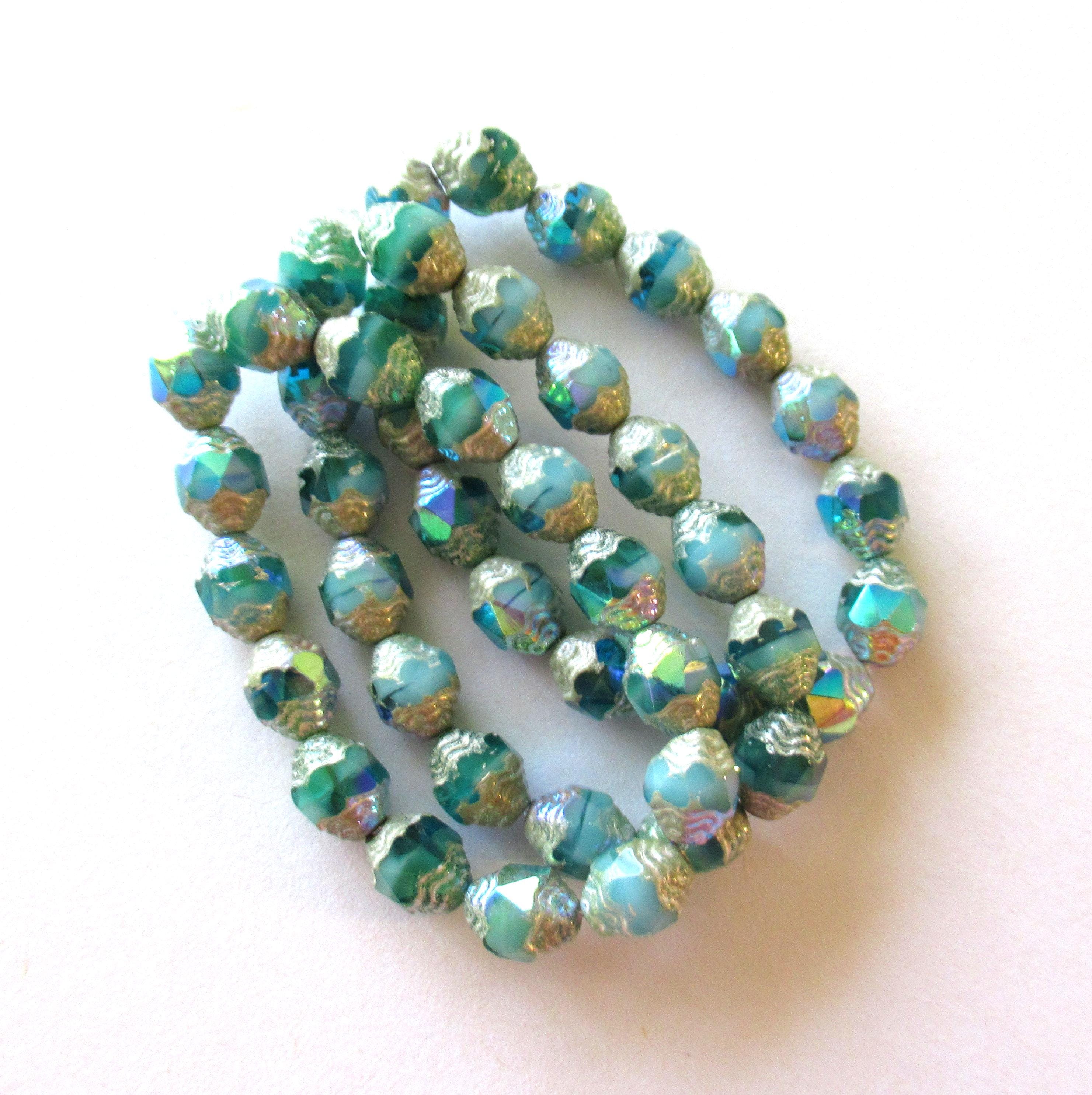 15 Czech glass mini antique style faceted carved oval cathedral beads - 8 x 6mm - opaque & transparent blue green ab w/ silver accents - C000572