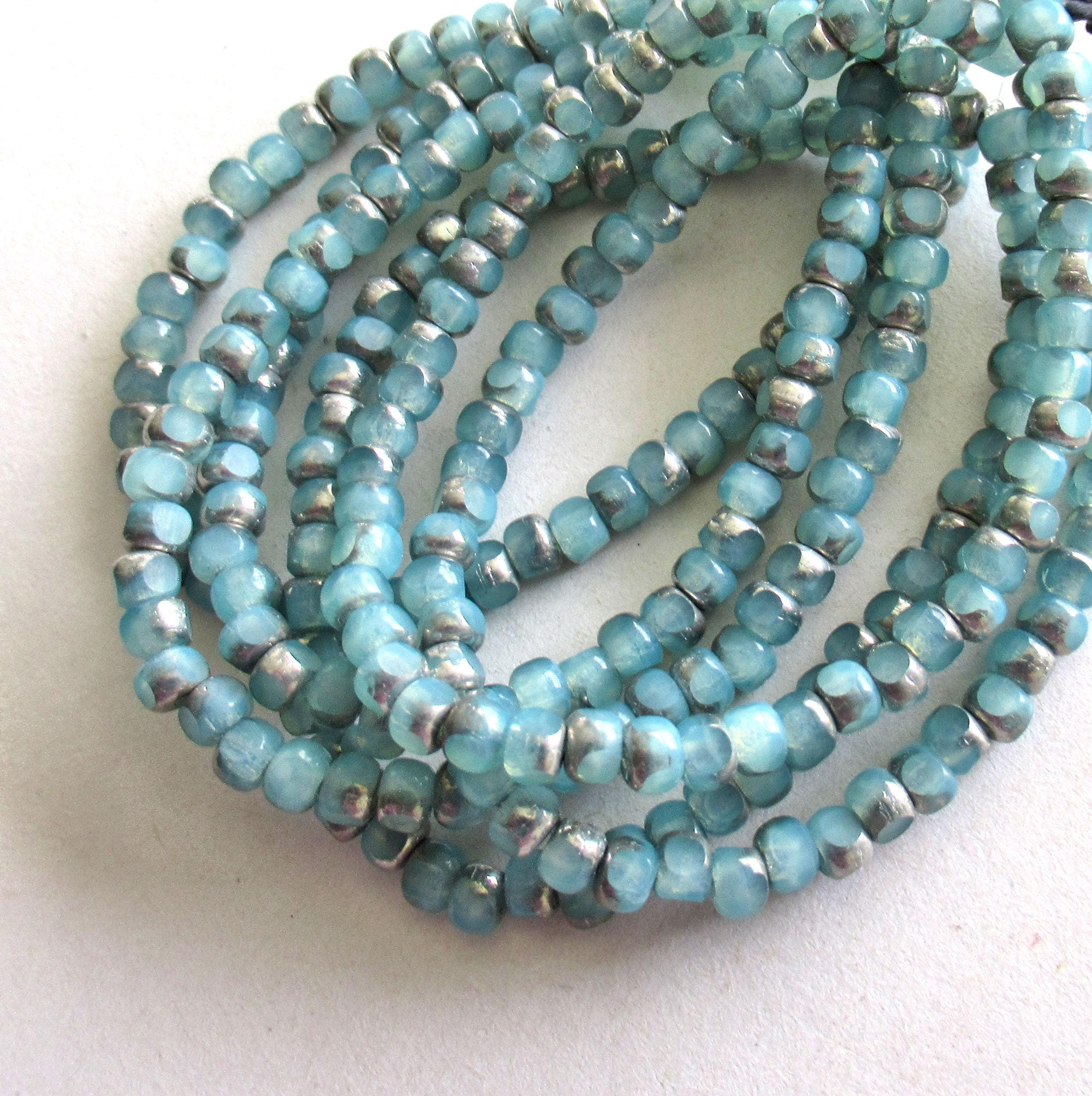 50 Czech glass 6/0 faceted seed beads - translucent ice blue with silver accents - 3 cut - tri-cut 4 x 3mm beads C00911