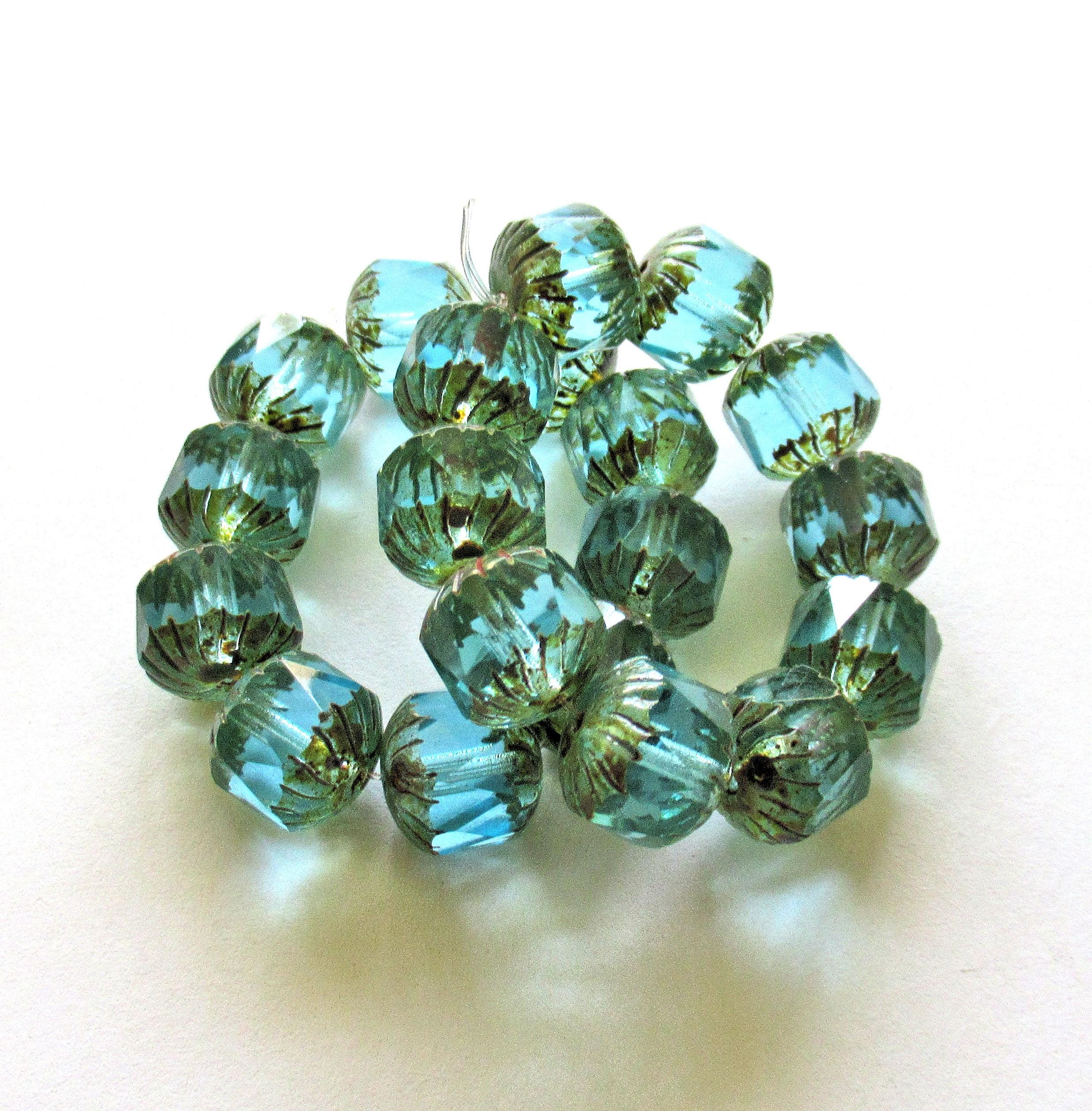 Ten Czech glass faceted carved cruller beads - 10mm - transparent aqua blue - cathedral beads w/ picasso accents on the ends - 00004