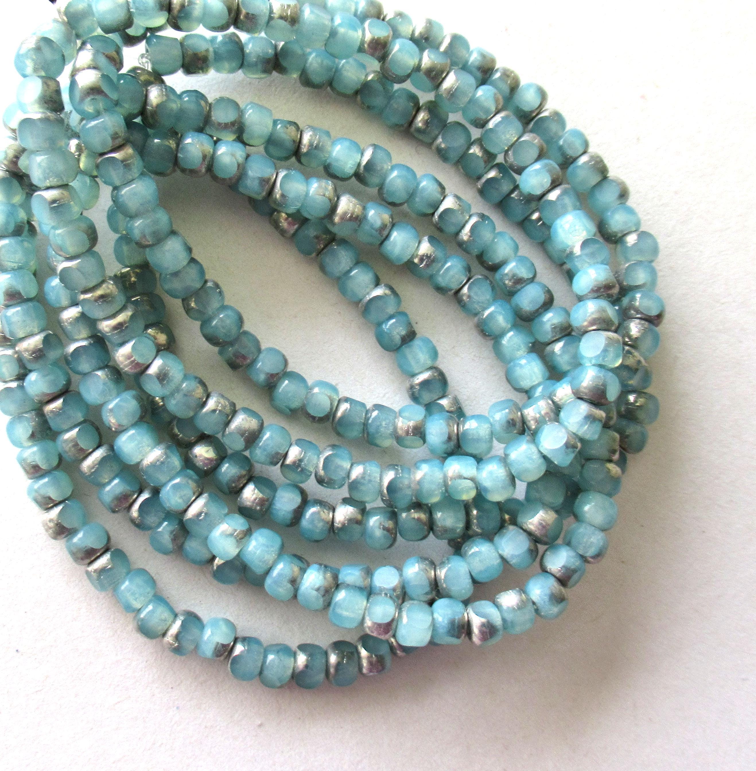 50 Czech glass 6/0 faceted seed beads - translucent ice blue with silver accents - 3 cut - tri-cut 4 x 3mm beads C00911