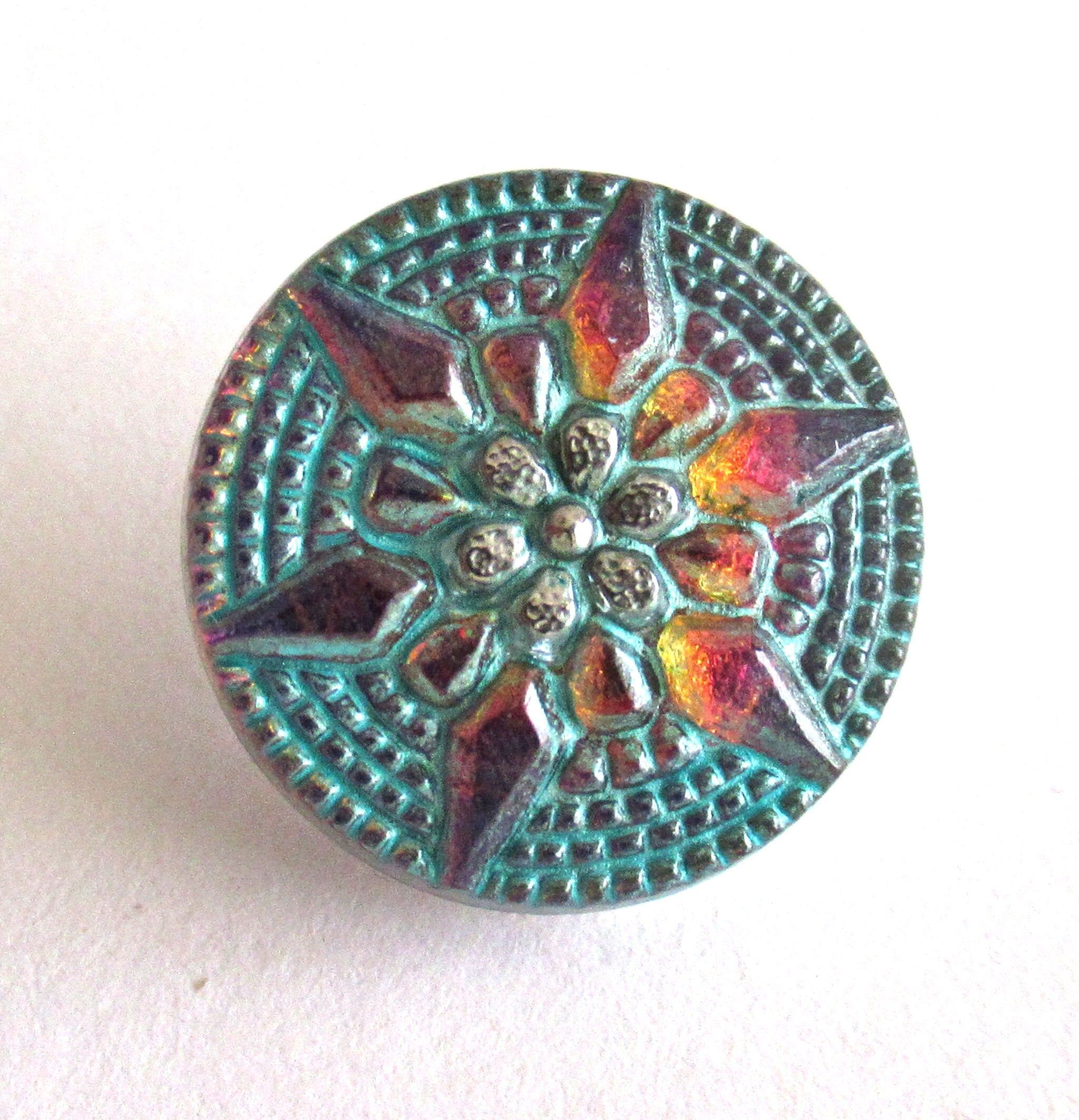 One 18mm Czech art glass button - multicolored gold raised star with a turquoise wash - verdigris look decorative shank button 00432